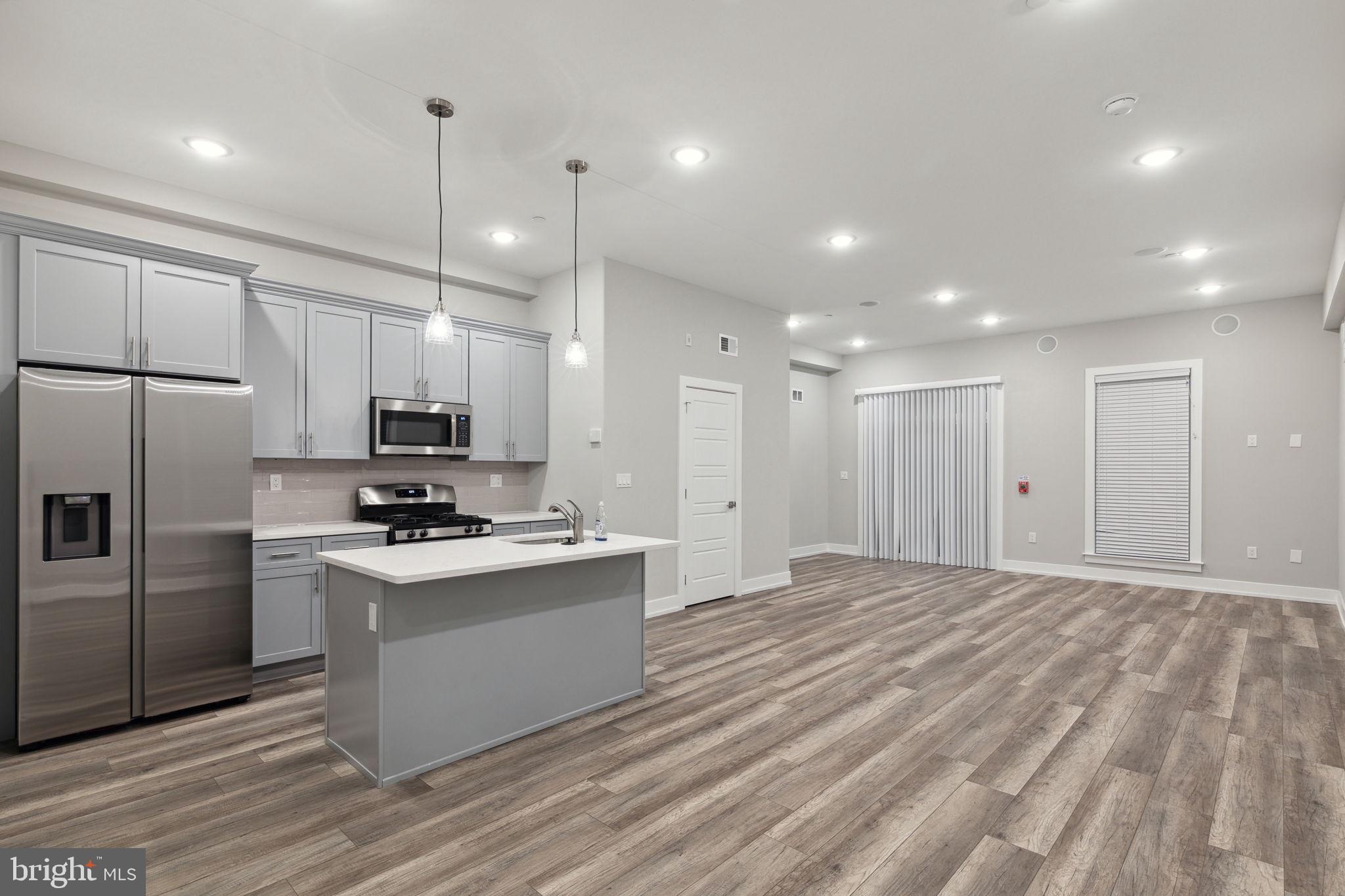 Discover modern urban living at its finest in this newly constructed quadruplex located at 2401 N Mascher St in the vibrant West Kensington neighborhood of Philadelphia. Each of the four units in this quadruplex is bi-level, offering a unique living experience. One unit features 2 bedrooms and 2 bathrooms, while the remaining three units showcase 2 bedrooms and 2 and 1/2 baths. The cleverly placed half bath on the main floor adds convenience to your daily routine. The open-concept living and kitchen spaces are designed to maximize comfort and flexibility. Stainless steel appliances, a kitchen island with quartz countertops, and ample cabinet space make these units a dream for both aspiring chefs and casual cooks alike. Each unit also has an in unit washer and dryer. Seize the opportunity to benefit from the remaining years on the tax abatement, a valuable feature that translates to significant savings. With the York-Dauphin Station for the Market Frankford Line just blocks away, commuting to Center City becomes a breeze. Plus, indulge in the culinary delights of Philadelphia with an array of fantastic restaurants just around the corner. Whether you're a homeowner looking to alleviate mortgage costs or an investor seeking a low-maintenance asset for your portfolio, this quadruplex presents an enticing opportunity. Embrace the urban lifestyle, capitalize on convenience, and make this modern gem your home or investment haven. Welcome to a new era of sophisticated living in West Kensington!