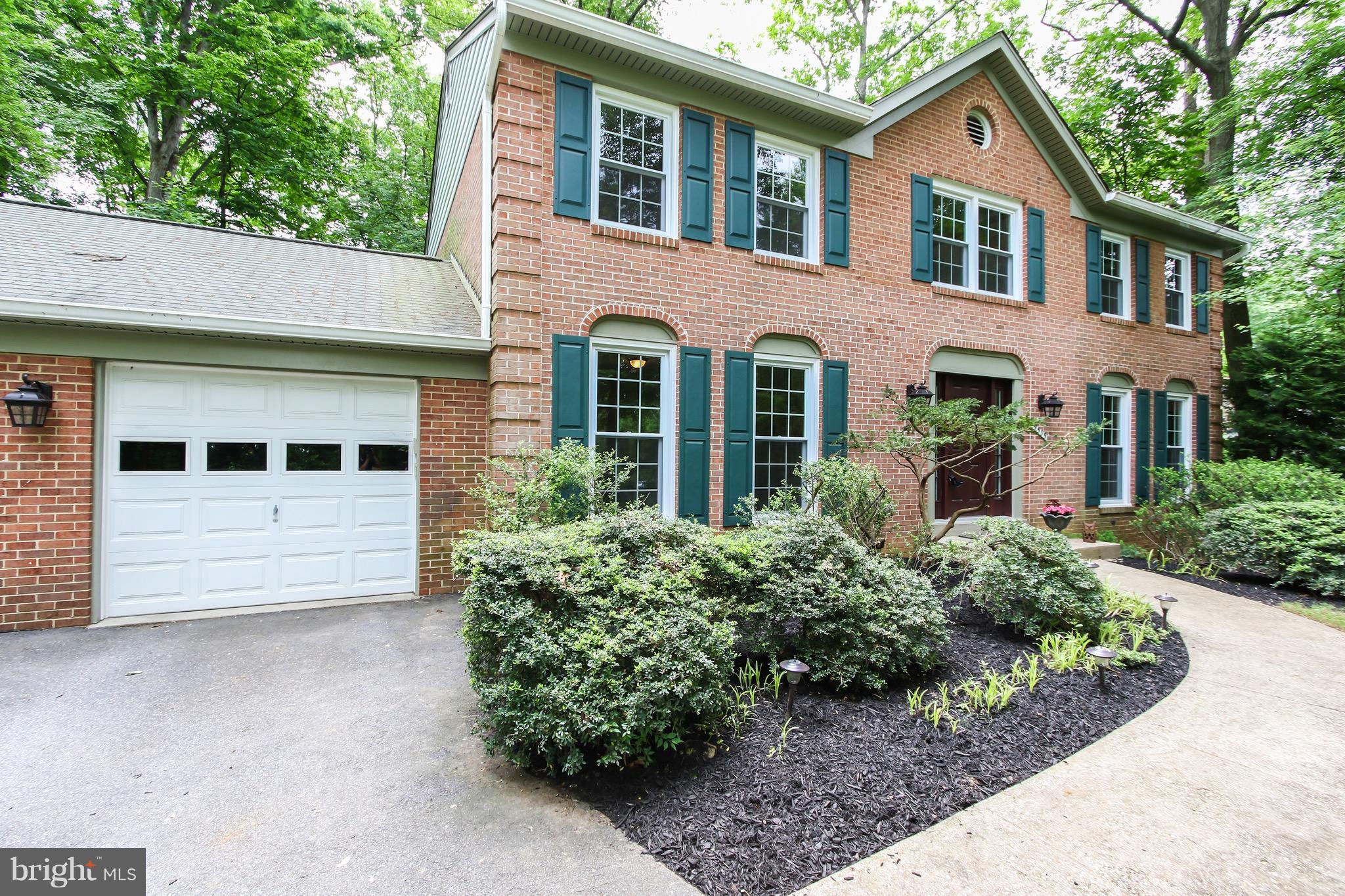 Hidden treasure on private lot. Close to everything but still very private. Completely updated & move in ready. Updated kitchen & bathrooms! Freshly painted, refinished hardwood floors, new carpet in basement. Sitting room off master.  Beautiful no maintenance deck backing to private backyard. Vinyl replacement windows, new doors. Walk out basement w/ fireplace, bedroom & full bath. No HOA!