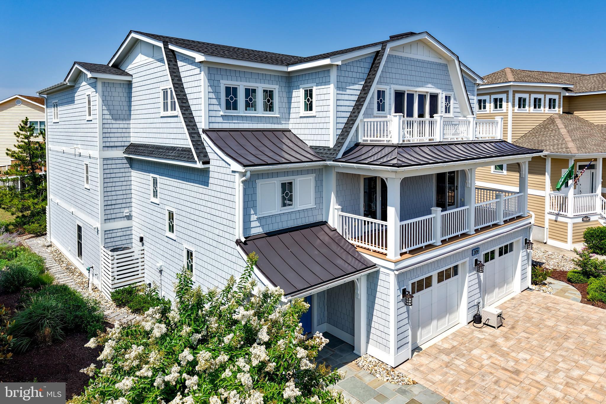 BEACHSIDE MASTERPIECE defining the pinnacle of luxury coastal living! Perfectly positioned just steps from the private beach and community pool in coveted Cape Shores, this turnkey 7-bedroom, 7-full and 2-half bath estate by Lane Builders offers three expansive levels of impeccable craftsmanship, exceptional design, and unrivaled amenities. Offered fully furnished with curated designer interiors, this extraordinary home is ready for immediate enjoyment, whether as a private coastal retreat or an excellent rental investment. Enjoy easy access to miles of pristine Atlantic beaches, scenic bike trails, and the natural beauty of Cape Henlopen State Park. Every detail has been thoughtfully designed to provide the ultimate in comfort and sophistication. Each of the seven spacious bedrooms features its own private en-suite bath, appointed with distinctive designer tile and natural stone finishes, while the top-floor powder room showcases a dramatic waterfall stone feature wall. The spectacular top-level living space centers around a chef’s kitchen equipped with Sub-Zero, Wolf, and Bosch appliances, custom cabinetry, an oversized walk-in pantry, and an impressive center island. Ideal for hosting family and guests, the home also offers two expansive family rooms, a second kitchen in the patio-level recreation room behind custom barn doors, two laundry rooms, and a fully equipped wet bar with two under-counter refrigerators, a second dishwasher, ice machine, and instant hot water. A 1,000-pound capacity elevator provides effortless access to all three levels. Outdoor living is every bit as impressive. Take in bay views, coastal breezes, and sunsets from the rooftop deck, or entertain on the expansive top-floor outdoor living area featuring seating for 31, a screened porch with a built-in gas grill, outdoor television, and motorized privacy sunshades. Bluestone walkways, professionally designed landscape lighting, and underground irrigation create a resort-like setting. Additional beach-friendly amenities include two outdoor showers, a dedicated exterior-access beach storage room, and an oversized 27’ x 25’ garage with 10-foot-wide doors, providing ample room for large SUVs and beach gear, plus two 240-volt EV charging outlets. State-of-the-art smart home technology by Overture seamlessly integrates Lutron automated lighting, Sonos surround sound, and exterior security cameras. Engineered for comfort and peace of mind, the home also features two high-efficiency heat pump systems with propane furnace backup, two tankless water heaters, and a whole-house standby propane generator. This is a rare opportunity to own one of Cape Shores’ newest and most exceptional luxury residences, where timeless craftsmanship, modern technology, and an unbeatable beachside location come together to create an unparalleled coastal lifestyle. Schedule your private tour today and experience this remarkable home for yourself.