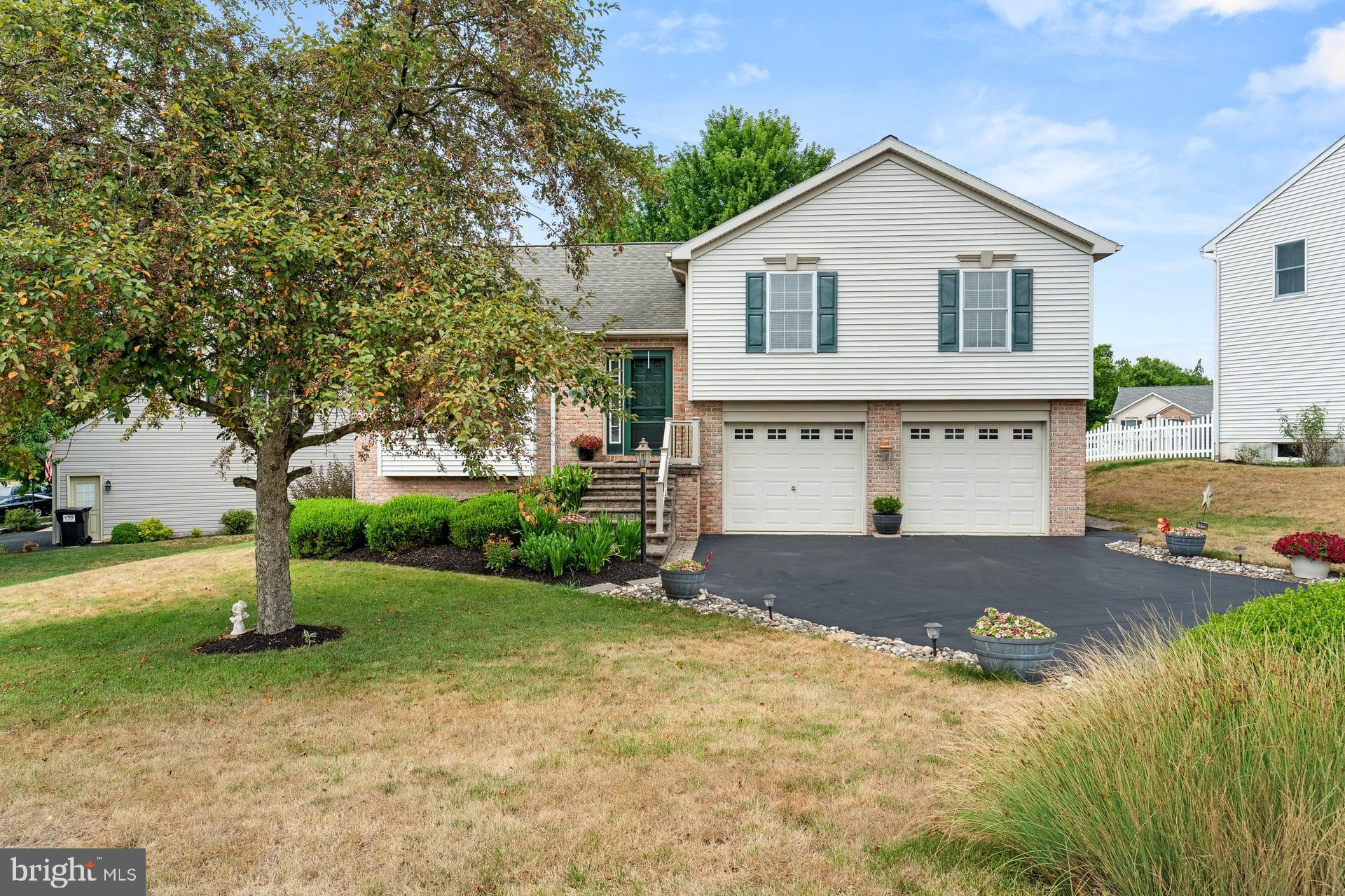 Lovingly maintained by its original owners, this charming Landmark-built split-level home is located in the desirable Oaks of North Londonderry and within the Palmyra Area School District. Offering 3 bedrooms, 1.5 baths, and a thoughtful layout, this home combines warmth, quality, and numerous updates throughout.

The main level features a spacious living area, and an updated kitchen with granite countertops, slate appliances, and plenty of cabinet space. The dining area features a rich dark engineered hardwood flooring and opens to a two-level composite deck overlooking the backyard, creating the perfect space for entertaining or relaxing outdoors. A natural gas fireplace anchors the lower-level family room, which also provides walk-out access to the backyard.

At ground level you will find a family room with glass doors opening to the deck and access the back yard.  This level also includes a powder room making it perfect for entertaining.

Major mechanical updates include a natural gas water heater (2018) and a natural gas furnace with central air conditioning (2021), offering peace of mind for years to come. The washer, dryer, and kitchen refrigerator are all included with the sale.

One of the home's standout features is the rare true lower-level basement—an upgrade selected during construction that provides exceptional storage space rarely found in this style of home. Completing the property is an oversized two-car garage, mature landscaping, and outstanding curb appeal in one of North Londonderry Township's most desirable neighborhoods.