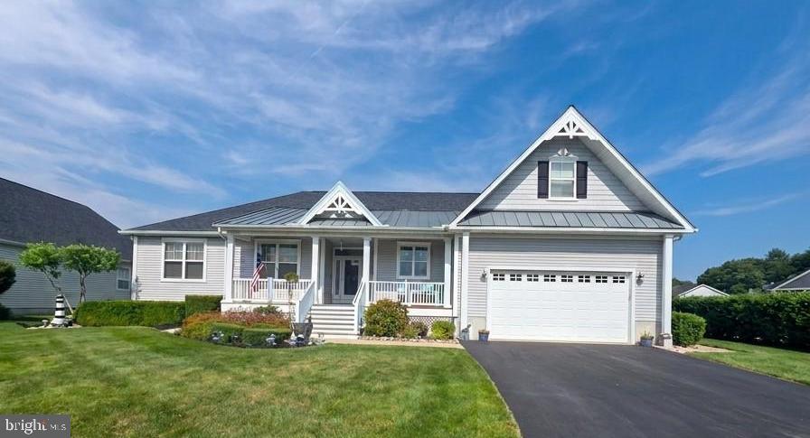 Professional pictures coming! ......   Experience refined waterfront living in one of Coastal Delaware's most sought after communities.  This elegantly furnished residence offered complete with high end designer pieces and a premium pool table estimated at $15,000 delivers a turnkey lifestyle of comfort, sophistication and ease.  Every major upgrade has already been completed, including a new roof in 2024, new HVAC 2023, and new tankless hot water heater in 2023 ensuring the home is a effortless as it is beautiful.  Owner pride is obvious in this one owner home.  the inside of this home is graced with hardwood and tile flooring, California shutters which adorn every window and the sliding glass door in the living room, skylights and an open floor plan were designed for both style and function in this home.  The chef inspired kitchen features new granite countertops, a large white farm sink and new refrigerator.  white Hardwood cabinetry with slide out shelving creates a bright timeless aesthetic.  Custom white built-ins elegantly frame the living room's gas fireplace  which is a perfect place to unwind while watching boats drift along the canal toward the Assawoman bay and Atlantic Ocean.  Offering 2.5 bathrooms and 3 bedrooms with a 2nd floor flex room currently used as a billiards lounge (can easily be converted to a 4th bedroom) a 1st floor master suite offers an ensuite with jacuzzi tub and walk in shower.  A laundry room with top of the line washer and dryer, and a 2 car garage with epoxy flooring. This home  blends luxury with versatility.  The rear porch invites you to sit and relax taking in serene water views, making every day feel like a retreat.  Set within the community of "The Refuge", a premier community known for its upscale amenities and vibrant social atmosphere, residents enjoy access to a resort style pool, tennis and basketball courts, walking trails and a calendar full of residential gatherings, from pool aerobics to ice cream socials,  The newly added Daybreak Cafe offers a refined neighborhood hub for morning coffee, casual dining and friendly conversation. This community continues to be one of the region's most desirable destinations for those seeking an elevated coastal lifestyle.  A furnished, upgraded impeccably maintained waterfront home of this caliber is a rare offering in this community and an exceptional opportunity for the discerning buyer. Your Boat & Kayak Ramp are located next to the home,  everything is walking distance from this home. Buyer home warranty included.