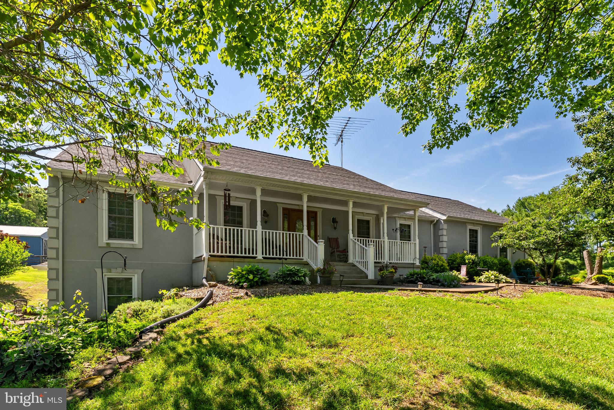 RARE OPPORTUNITY to own a versatile country estate featuring a beautifully maintained 4,000 square feet, 4 bedroom, 3 bath ranch home, scenic acreage, an in-law suite/apartment offering over 1500 square feet of living space, extensive outdoor living spaces, a large barn, oversized garage and multiple outbuildings.  Whether you are seeking a private retreat, multi-generational living, farmette, workshop space, or room for all your toys and equipment, this exceptional property offers the space, functionality, and lifestyle you’ve been searching for.

Nestled on beautifully maintained grounds with sweeping views of rolling lawns, mature trees, peaceful creek, this exceptional ranch-style home offers the perfect blend of elegance, comfort, and country charm.  

A welcoming covered front porch invites you inside, while the home’s elevated setting showcases breathtaking views in every direction.  The expansive lawn and park-like landscape creates a serene setting ideal for entertaining, relaxing, or simply enjoying nature.  A winding paved and concrete driveway leads through the property enhancing the sense of privacy and estate like appeal.

Inside, you’ll find spacious living areas designed for everyday comfort and gatherings alike.  Hardwood floors throughout the first floor, large windows capturing natural light and frame the stunning outdoor scenery.  Whether enjoying your morning coffee on the front porch, back screened porch,  deck or private patio off the in-law suite/apartment, watching the sunset across the property every day feels like a getaway.

Step outside and enjoy multiple outdoor spaces designed for relaxation and entertaining.  The expansive covered screened in porch, deck, private patio and covered pavilion provide the perfect setting for summer cookouts, morning coffee, or gathering with family and friends while overlooking the scenic property.  The enclosed porch and sunroom offers year-round enjoyment and seamless indoor-outdoor living.

A standout feature of the property is the impressive oversized barn totaling over 1800 square feet that includes water and electric and with oversized sliding doors, loft, six stalls offering exceptional space for livestock, space for equipment storage, hobbies or recreational vehicles.  Additional outbuildings and garage space provide flexibility for contractors, car enthusiast, farmers or anyone needing extra storage and workspace.

Adding tremendous value and versatility, the property includes a private in-law suite/apartment of over 1500 square feet with separate living space and independent access including a huge bedroom, living room, bath and kitchen, laundry and storage, ideal for multi-generational living, guest accommodations, or potential rental income.  This unique feature provides flexibility to meet a variety of lifestyle needs.

This rare property offers the tranquility of country living while remaining convenient to nearby amenities.  Just 8 minutes to the Town of Culpeper,  30 minutes to Warrenton, 45 minutes to Fredericksburg and 45 minutes to Charlottesville.   A true ideal location and special place to call home.