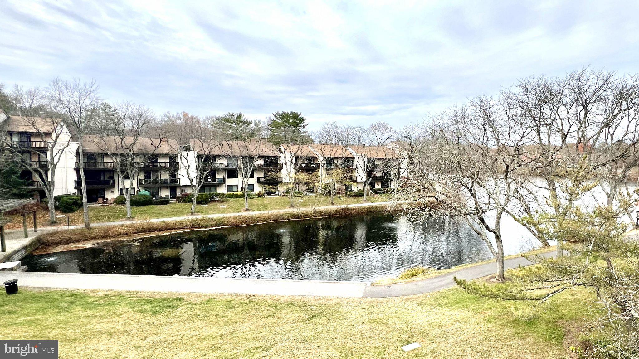 Welcome home to this beautifully refreshed top-level, 2-bedroom/2-bathroom condo overlooking Wilde Lake in Columbia, MD, offering ample natural light and a design that is both warm and inviting. This unit provides a modern feel with sought-after features like new flooring throughout, a refreshed kitchen counter/bar, and a newly-installed all-in-one washer/dryer unit - perfect for quick move-in. The open concept living room/dining room combination is ideal for gathering and entertaining, leading directly out to a two-door private balcony that offers stunning, peaceful views overlooking Wilde Lake. Offering style, function, and convenience, this condo is located in the highly desirable Cove/Village at Wilde Lake community, close to the Columbia Mall, Merriweather Post Pavilion, outdoor recreation, and major commuter routes. Schedule your showing today!