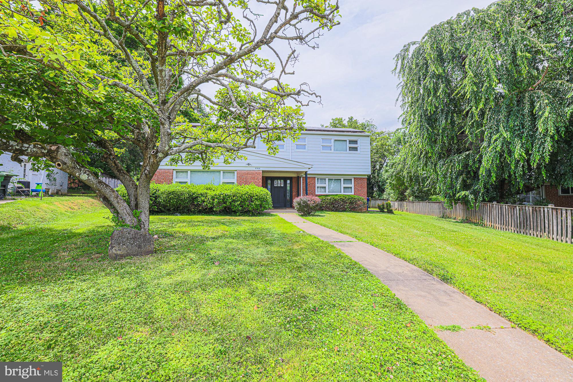 This spacious brick four-level split, sited on a private oversized lot, offers a flexible floor plan ideal for everyday living and entertaining alike. Oversized windows throughout fill the home with natural light. The main level features a bright living room and dining room with gleaming hardwood floors, and an updated modern kitchen. 
Upstairs you'll find three generous bedrooms, including a primary suite with private bath, plus a fully remodeled bathroom. Two additional finished levels provide a family room, rec room, laundry, plenty of storage, and a fully remodeled full bathroom -offering excellent potential for an entry-level primary suite or private in-law apartment, perfect for extended family, guests, or multi-generational living.
Step outside to a huge deck overlooking the private, oversized backyard — perfect for summer entertaining, play, or future expansion. Additional highlights include updated windows and systems, central air, and gas heat,
Located within the eruv and just minutes from houses of worship, Greenspring Shopping Center, Quarry Lake, Mt. Washington shops and restaurants, I-83, and the Beltway. See and make offer.