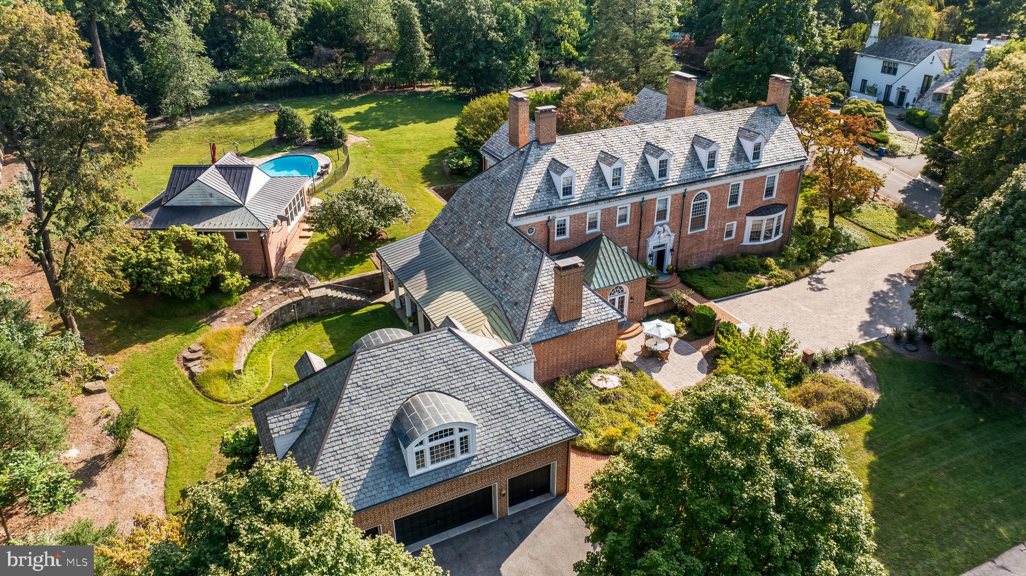 Pure elegance. Singular opportunity

Welcome to 20 Blythewood Road—an extraordinary Georgian estate blending classic architecture with refined modern luxury. Set on 1.58 acres of meticulously landscaped grounds in one of Baltimore’s most prestigious enclaves, this iconic 1926 residence offers over 7,600 square feet of sophisticated living space.

Inside, you’ll find six bedrooms, five full and two half baths, and a layout designed for both grand entertaining and intimate living. Highlights include a marble entry hall, multiple fireplaces, a chef’s kitchen butler's pantry,  and a climate-controlled wine room. The sunroom, library, and formal living and dining rooms showcase elegant millwork, hardwood floors, and classic detail throughout.

The second-floor primary suite is a retreat of its own—with a sitting room, private office, fireplace, and spa-like bath featuring a steam shower and jetted tub. Additional floors offer bonus rooms, a cedar closet, and flexible space for guests or staff.

This property offers resort style living with a heated oval pool, sunken garden, and a pool house complete with a gym, media room, and full bath.  A spacious four-car garage also includes a private guest apartment with two bedrooms and two full bath-ideal for extended stays, a home office or multi-generational living. 

Rich in history and prestige, this estate is now ready for its next chapter.
 ** Measurements, Room Count, and Bath Count include Main Residence Only***