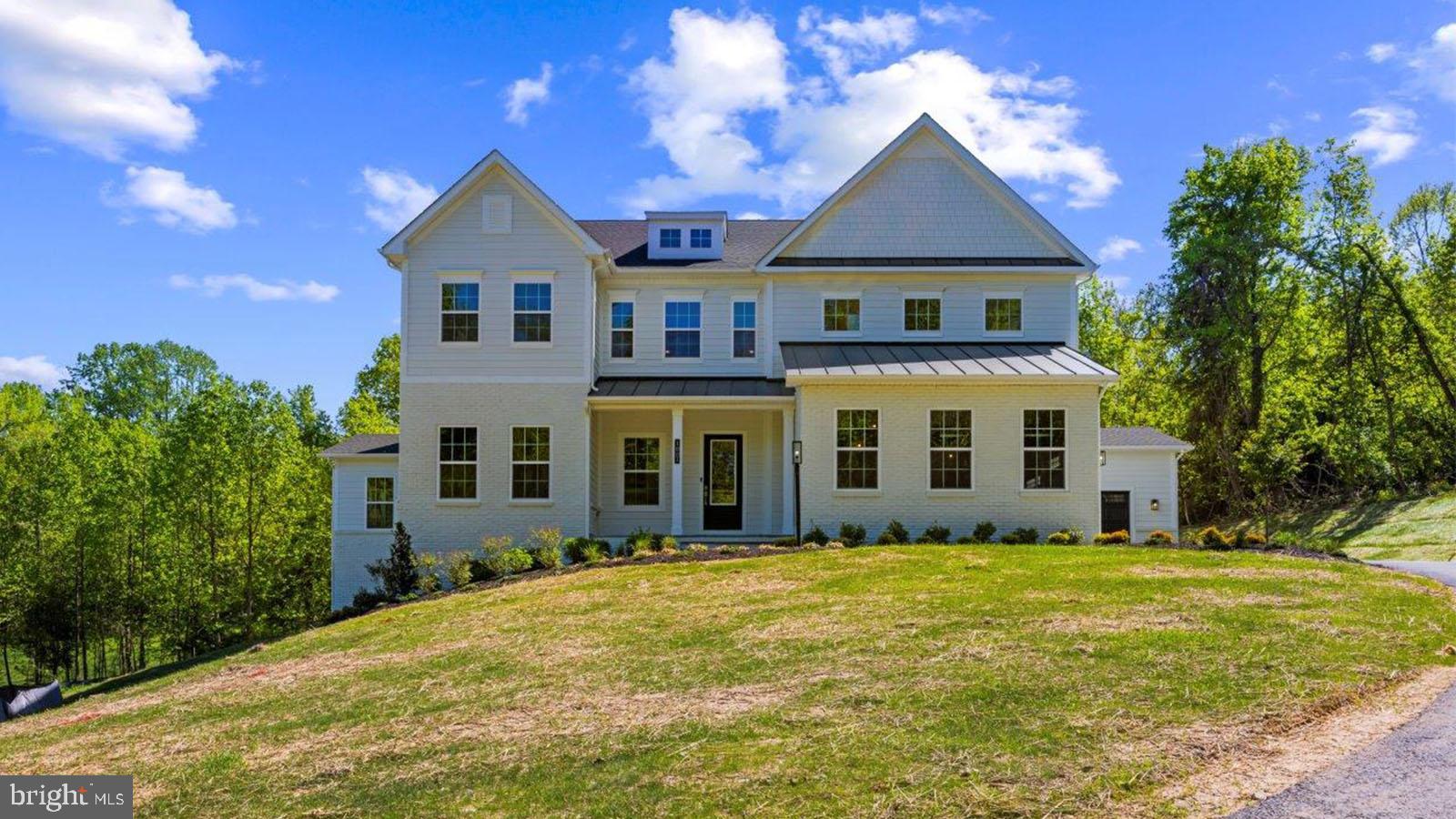 MOVE IN READY….STUNNING WOODED VIEWS! Welcome to Stillview Acres by D.R. Horton EMERALD. Meet the Hampton II which includes 6 bedrooms/6.5 baths with a 4-car garage. The exterior of this stunning home is with contemporary painted brick, James Hardie siding and flagstone porch. Enter this home from a covered porch and view the soaring 2-story foyer. A flex room greets the entrance for use as you prefer- a home office or formal living room. The formal dining room is off the foyer and includes tray ceilings. Tray ceilings are also included in the family room and kitchen area with beamed ceilings. The kitchen and great room share the ever-desired open concept feel. Stay cozy near the contemporary linear fireplace and enjoy picturesque views from the double sliding glass doors. The kitchen is complete with Aristokraft soft-close cabinets with below cabinet lighting and quartz counters. This Hampton II is complete with our Pro-Kitchen that takes cabinets to the ceiling with down lighting for display, high-end KitchenAid gourmet appliances with a 36” gas range, microwave/oven combo, dishwasher, and French door refrigerator a dedicated beverage center. 10 Foot ceilings are throughout the main level with 9 foot doors provide airy feel throughout. The owner entry is positioned nearby and includes a drop zone with lockers with coat closet adjacent. A private first floor bedroom is tucked away with walk-in closet as well as a main level full bath with walk-in shower. The solarium is off the family room providing gorgeous, wooded views perfect for entertaining. Oak stairs with iron balustrade lead to the bedroom level. The primary is at the top of the staircase and is finished with a bedroom and sitting area with tray ceilings. Enter the primary bath through a generous hall through French doors. This bathroom will take your breath away! A walkthrough glass front shower is the focus of this bath with double shower heads, overhead rain faucets and a free-standing tub in front. Separate vanities provide plenty of storage with soft-close cabinets and quartz counter tops. A water closet is off to the side. Interior designers selected all tile and flooring- this is by no means a “builder grade” bath! Two generous walk-in closets are in this bedroom. Mohawk Revwood floors are featured in the hallway and primary bedroom. For convenience, the laundry room is on the bedroom level which includes cabinets and a utility sink. Storage is abundant with two linen closets. All secondary bedrooms are generously sized and include a bath and walk-in closet. Secondary baths finished with custom ceramic tile, soft-close cabinets, and quartz counters. The basement is complete with a recreation room, full bath, and bedroom with walk-in closet. Unfinished storage space is also provided. The basement and bedroom level features nine-foot ceilings and a partial walk-out condition.. Stay connected to your home with our home is connected package. A video doorbell, Echo Dot, Zwave thermostat and door lock and wi-fi enabled garage door openers. This home is a must see! We can’t wait to welcome you to the D.R. Horton Family!