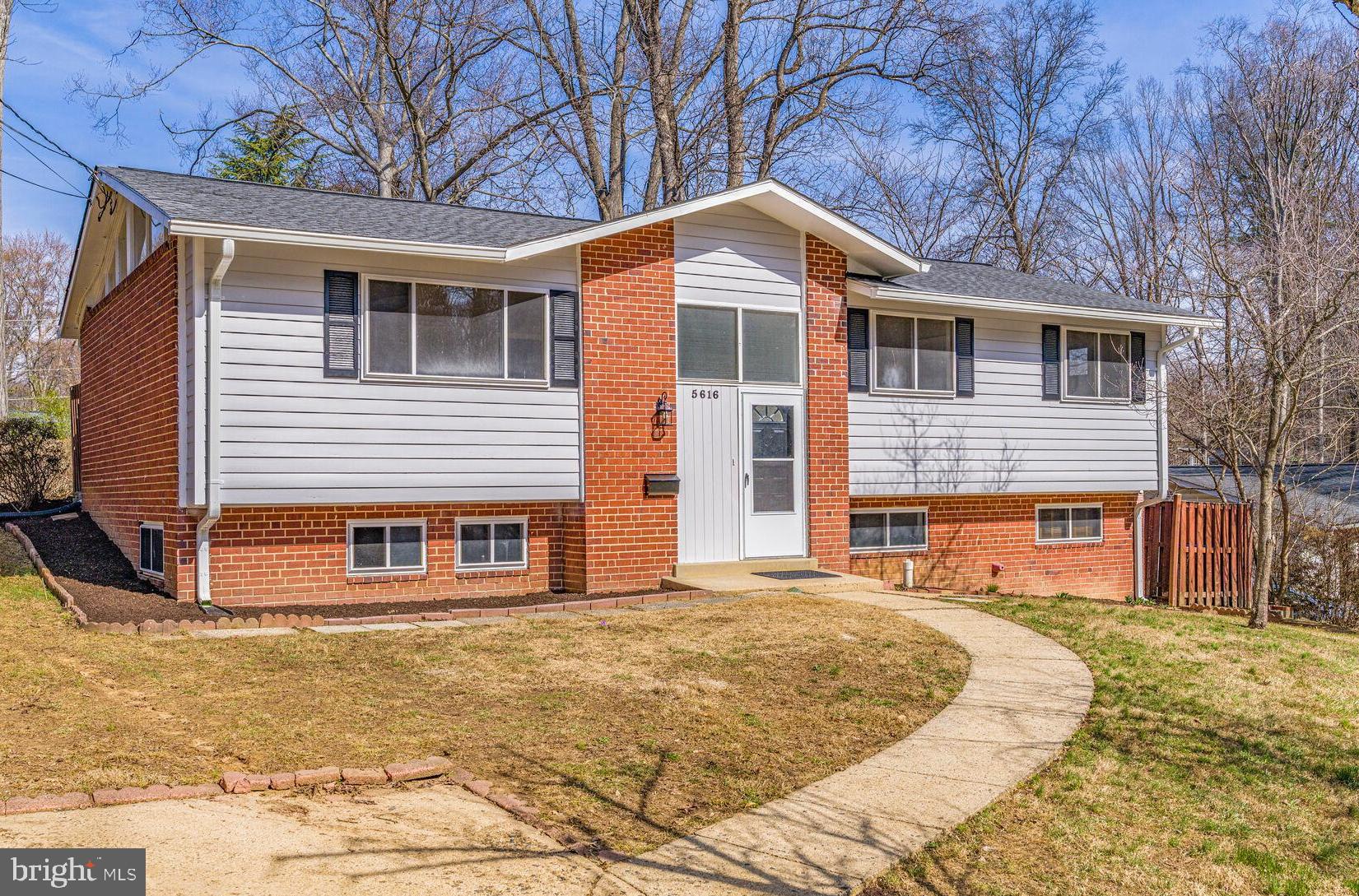 This move-in ready home could be the one for you! With a brand-new kitchen, brand-new roof, and numerous updates, this 4-bedroom, 3-bathroom gem in the highly sought-after Fairfax County School District (Lake Braddock Secondary School) is truly worth considering.  Ideally located on a quiet street in the Kings Park subdivision with NO HOA, this home offers privacy and convenience. The primary bedroom features an en-suite bathroom and an oversized walk-in closet, while the backyard backs up to trees and provides ample space for gardening.  Freshly painted inside and out, this home is filled with light and brightness. The new roof with architectural shingles and 6” gutters was installed in November 2024, and the newly remodeled kitchen boasts blue and white shaker cabinets, white quartz countertops, and stainless-steel appliances. Newly sanded and stained white oak hardwood floors add warmth and coziness to the main floor, and the open floor plan is perfect for entertaining.  The lower level, accessible from the side entrance,  features a spacious recreation room, bedroom, full bathroom, and a huge utility room with a workbench and plenty of storage.  Located just minutes from Braddock Road, Burke Lake Road, Rolling Road, 495, VRE, and Fairfax County Parkway, this home offers easy access to Audrey Moore Recreation Park, Lake Accotink Park, Burke Lake Park, schools, restaurants, grocery stores, and the Kings Park Library.  This lovely home is waiting for you!