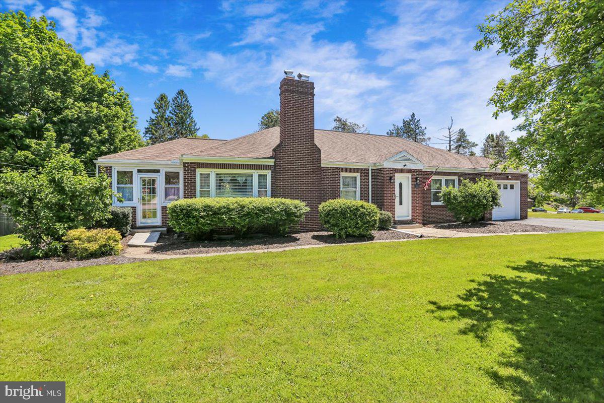 Spacious and beautifully maintained all-brick rancher offering approximately 3,660 square feet of living space with room for everyone! This impressive home features 5 bedrooms, 2 full bathrooms, and a fully finished basement with its own private entrance—perfect for in-law potential, extended family living, or flexible multi-generational use.

Inside, you’ll find a welcoming living room with custom built-in cabinetry, a separate formal dining room, hardwood floors, and two cozy fireplaces that add warmth and character throughout the home. The bright and inviting sunroom provides the perfect place to relax year-round with abundant natural light and additional living space for entertaining or quiet mornings at home.

Outdoor living is just as impressive with a large, fully fenced rear yard, rear deck ideal for entertaining, plenty of parking, a one-car garage, and an oversized 28x12 shed offering exceptional storage or workshop space. Additional updates include replacement windows and an HVAC system approximately 6 years old for added peace of mind.

Conveniently located within walking distance to town, hospital and medical offices, pharmacy, dining, and banking, this home combines space, comfort, and accessibility in one exceptional property.