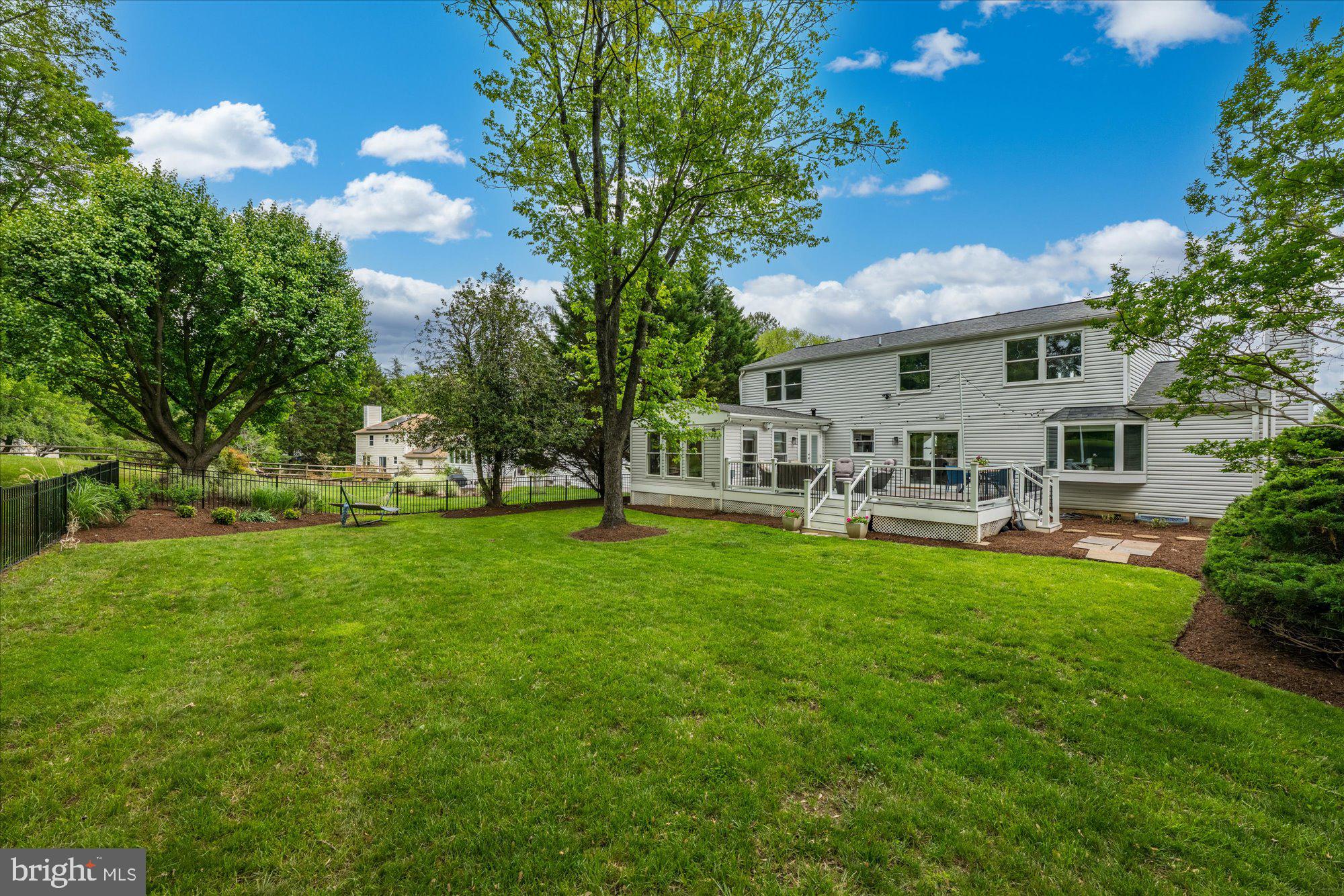 Welcome to 11209 Maine Cove Drive, a stunning colonial with over $250,000+ in thoughtful renovations (2022–2024), nestled on a premium lot backing to two acres of serene green space in the sought-after Dufief Mill community. This home has been meticulously updated throughout and is move-in ready, including a major four-season sunroom addition. offering modern luxury and timeless comfort.
The home boasts a renovated gourmet kitchen with Wellborn custom cabinetry, under-cabinet lighting, granite countertops and backsplash, stainless steel appliances with an induction range, and commercial-grade ventilation. The kitchen flows seamlessly into the spacious family room, which features a distinctive bay window, wood-burning fireplace with a painted brick accent wall, and custom built-in bookshelves. The dining room, with crown molding and large windows, opens to both the kitchen and a cozy sitting room.

The Crown Jewel of the home is the new four-season sunroom addition (2023), complete with hardwood floors, a sound system, recessed lighting, custom blinds, and a ceiling fan. French doors lead to a 400+ square foot composite deck (also new in 2023), featuring a hot tub, Bose outdoor speakers, and ambient lighting—perfect for entertaining.

The upper level is a sanctuary of relaxation. The primary suite is a retreat unto itself, featuring a spa-inspired soaking tub, walk-in shower, double-sink vanity, and a designer custom walk-in closet with frosted glass doors and motorized blackout shades. Secondary bedrooms include built-in closets, blackout blinds, and ceiling fans, while the hall bath offers sleek modern finishes. A brand-new laundry room, equipped with high-capacity LG appliances, expanded linen storage with a custom Elfa system, and a built-in ironing board, adds ultimate convenience.

The finished lower level includes a legal bedroom with an egress window, a full bathroom, and five closets with built-in shelving. Waterproof laminate flooring, modern lighting, and raised ceilings complete this versatile space, perfect as a recreation room, guest suite, or home office.

Curb appeal abounds with a newly resurfaced and widened driveway, painted front porch, and new front walkway. The backyard features professional landscaping and powder-coated aluminum fencing, while the garage has been fully updated with fresh drywall, paint, rewired electrical, and additional outlets.
Enjoy easy access to an abundance of shopping, dining, and entertainment venues, including the Kentlands, Falls Grove Village Center, Downtown Crown & Rio, Westleigh Rec Club, Stonebridge Swim Club, Lakewood Country Club, and more. Perfect for commuters, this home is just minutes from Rt. 28, I-270, ICC, and Shady Grove Metro, making it an ideal location for convenience and connectivity. Located in the Wootton School District this move-in ready home is truly exceptional. Don’t miss the opportunity to make this extraordinary property yours.