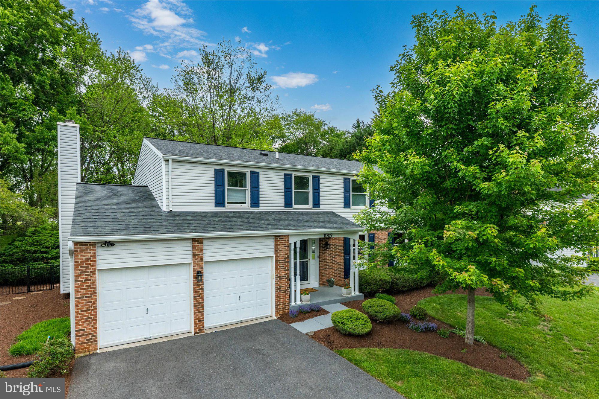 Welcome to 11209 Maine Cove Drive, a stunning colonial with over $250,000+ in thoughtful renovations (2022–2024), nestled on a premium lot backing to two acres of serene green space in the sought-after Dufief Mill community. This home has been meticulously updated throughout and is move-in ready, including a major four-season sunroom addition. offering modern luxury and timeless comfort.
The home boasts a renovated gourmet kitchen with Wellborn custom cabinetry, under-cabinet lighting, granite countertops and backsplash, stainless steel appliances with an induction range, and commercial-grade ventilation. The kitchen flows seamlessly into the spacious family room, which features a distinctive bay window, wood-burning fireplace with a painted brick accent wall, and custom built-in bookshelves. The dining room, with crown molding and large windows, opens to both the kitchen and a cozy sitting room.

The Crown Jewel of the home is the new four-season sunroom addition (2023), complete with hardwood floors, a sound system, recessed lighting, custom blinds, and a ceiling fan. French doors lead to a 400+ square foot composite deck (also new in 2023), featuring a hot tub, Bose outdoor speakers, and ambient lighting—perfect for entertaining.

The upper level is a sanctuary of relaxation. The primary suite is a retreat unto itself, featuring a spa-inspired soaking tub, walk-in shower, double-sink vanity, and a designer custom walk-in closet with frosted glass doors and motorized blackout shades. Secondary bedrooms include built-in closets, blackout blinds, and ceiling fans, while the hall bath offers sleek modern finishes. A brand-new laundry room, equipped with high-capacity LG appliances, expanded linen storage with a custom Elfa system, and a built-in ironing board, adds ultimate convenience.

The finished lower level includes a legal bedroom with an egress window, a full bathroom, and five closets with built-in shelving. Waterproof laminate flooring, modern lighting, and raised ceilings complete this versatile space, perfect as a recreation room, guest suite, or home office.

Curb appeal abounds with a newly resurfaced and widened driveway, painted front porch, and new front walkway. The backyard features professional landscaping and powder-coated aluminum fencing, while the garage has been fully updated with fresh drywall, paint, rewired electrical, and additional outlets.
Enjoy easy access to an abundance of shopping, dining, and entertainment venues, including the Kentlands, Falls Grove Village Center, Downtown Crown & Rio, Westleigh Rec Club, Stonebridge Swim Club, Lakewood Country Club, and more. Perfect for commuters, this home is just minutes from Rt. 28, I-270, ICC, and Shady Grove Metro, making it an ideal location for convenience and connectivity. Located in the Wootton School District this move-in ready home is truly exceptional. Don’t miss the opportunity to make this extraordinary property yours.
