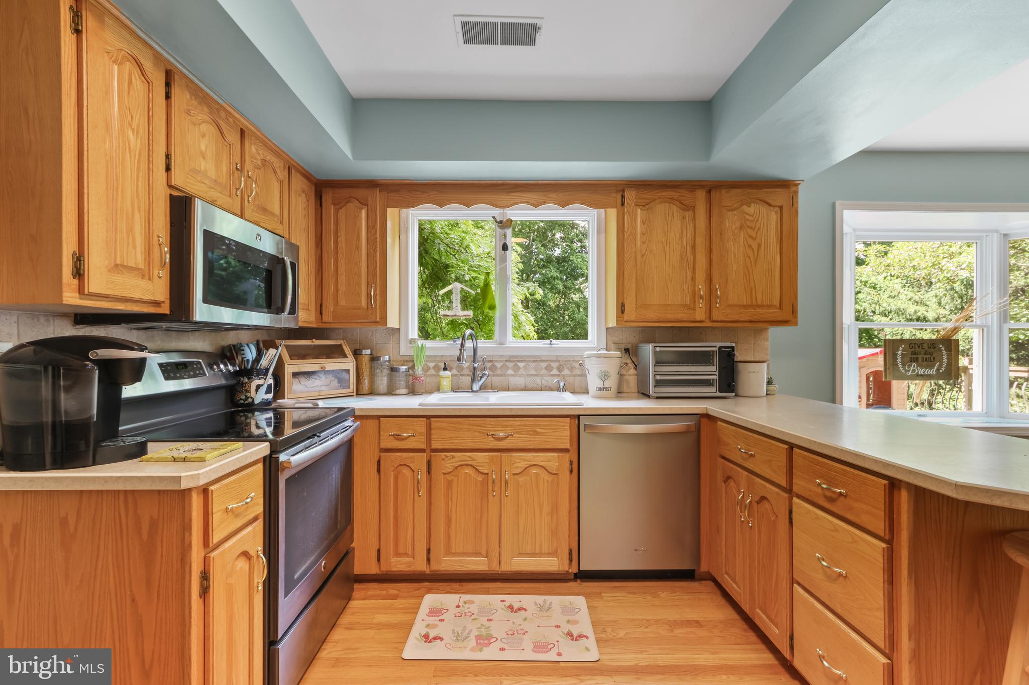 Situated on a private half-acre lot, this spacious center hall colonial offers the space, layout, and backyard you've been searching for.The main level features a formal living room and dining room, along with a kitchen that opens to the family room, creating a comfortable flow for everyday living and entertaining. The kitchen offers a breakfast area with bay window seating, while the family room is centered around a functional wood-burning fireplace. Hardwood flooring can be found throughout portions of the first floor, adding warmth and character to the home. A first-floor laundry room and convenient half bath complete the main level.Upstairs, the primary suite features a walk-in closet and private full bath, while three additional generously sized bedrooms and a full hall bath provide plenty of room for family, guests, or a home office.The partially finished lower level offers additional living space with a recreation room, built-in TV space, walk-in pantry, and storage room. Outside, enjoy the privacy of the large backyard featuring a deck, paver patio, fire pit, and storage shed—perfect for entertaining, relaxing, or enjoying the outdoors.Offering generous room sizes, a desirable floor plan, and the opportunity to add your own personal updates and touches, this home is ready for its next chapter in sought-after Wagner Farms. Ask how to receive up to $5,000 lender credit towards closing costs or lowering your interest rate!