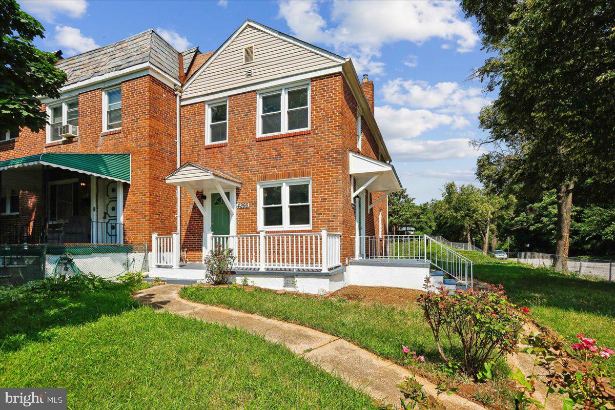 Stunningly renovated end-unit townhome with 3 bedrooms and 2 full baths. Open main level with hardwood floors and an updated kitchen featuring stainless appliances and quartz counters. Three bedrooms upstairs with a full bath, and a fully finished lower-level rec room. Off-street parking pad. Prime location near shopping — a must-see!