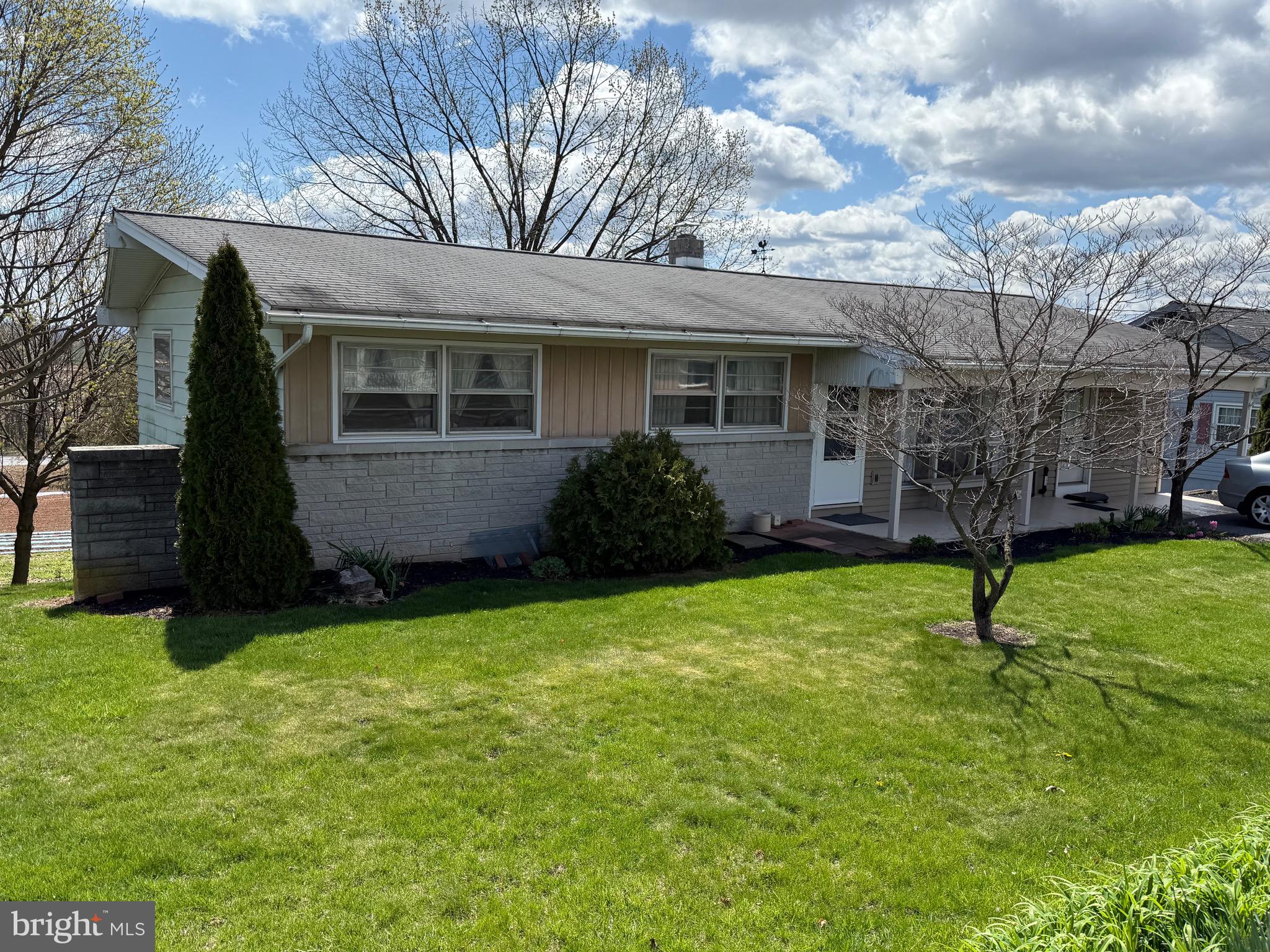 Welcome to this charming ranch-style home offering the best of both worlds, backs up to farmland and yet a convenient in-town location! This home is move in ready or a great flip project.  This home could use some updating and here is a great chance to make this home uniquely "you"!  This property features 3 bedrooms and 1.5 baths, providing just the right amount of space for easy living.  The 1 car garage has been converted into storage space so either change it back to a garage or add more living space!  Enjoy the convenience of public water and sewer, plus the comfort of single-level living. Whether you're relaxing on the back patio taking in the scenic views or taking a short stroll to nearby shops and amenities, this home is perfectly situated for both tranquility and convenience.
