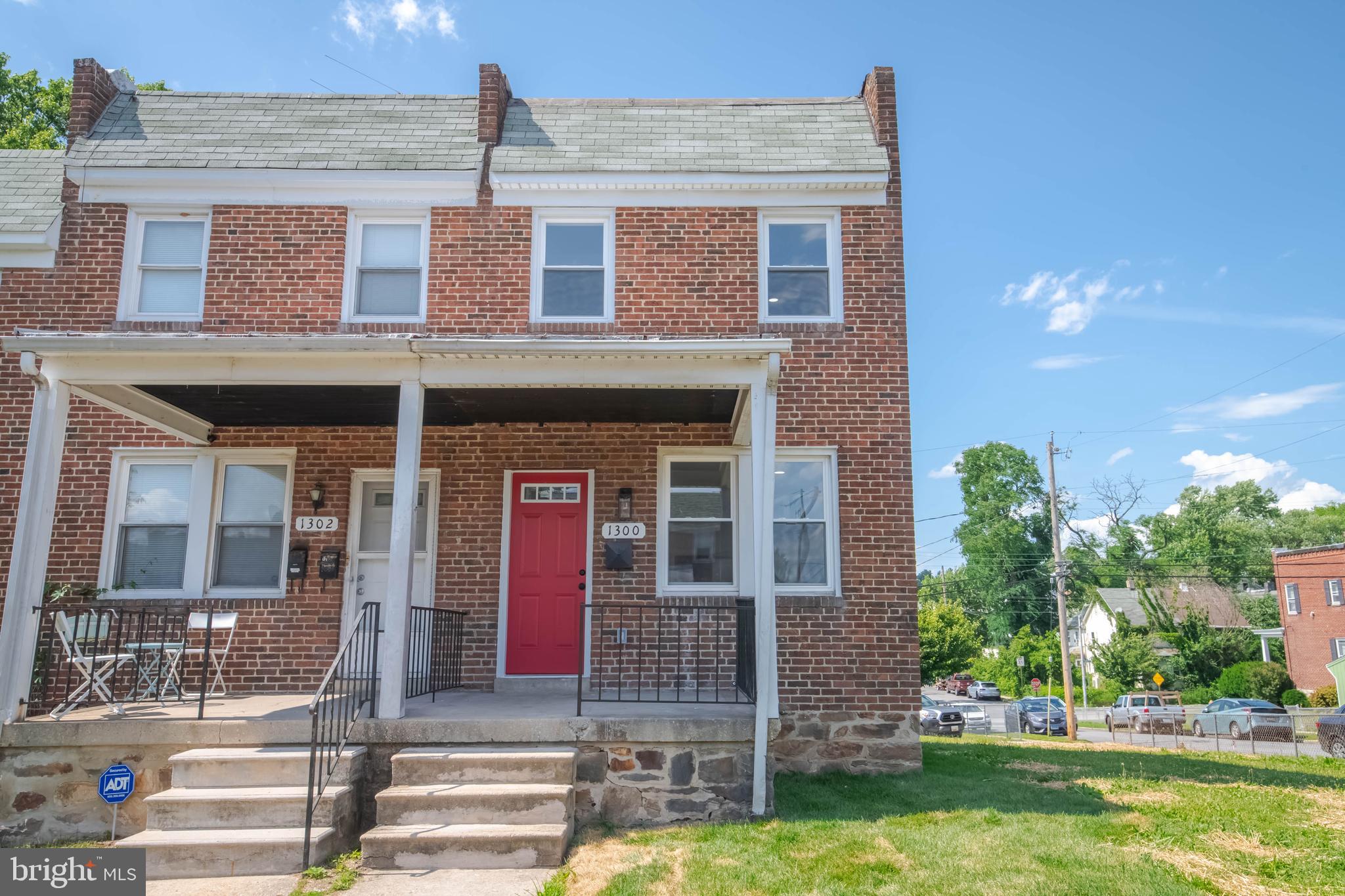 [Professional photos coming soon!] Welcome to 1300 W 37th Street, a fully renovated 4-bedroom, 4-full-bathroom end-of-group townhome in the heart of Hampden. Set on a sunny corner with sweeping open green space along its side, this classic Baltimore rowhome enjoys light, privacy, and breathing room rare for the neighborhood, with south- and east-facing windows brightening all three levels of its approximately 1,850 square feet of living space.

A south-facing covered front porch welcomes you inside, where the living room and kitchen greet you in one open, light-filled space. The kitchen centers on a breakfast bar peninsula featuring a gas range with a stainless steel overhead range hood, plus all-new stainless steel appliances. A pantry adds additional countertop and cabinet space. A rare main-level primary suite with a private full bathroom sits just off the kitchen, offering exceptional flexibility for single-level living, guests, or a private office setup.

Upstairs, a second primary suite features a private bathroom, a walk-in closet, and a versatile built-in nook ready to become a vanity station, dressing area, full-length lighted mirror, or custom shoe display. A second large bedroom and a hall bathroom with a bathtub complete the upper level.

The finished lower level adds a spacious recreation room, a fourth bedroom with generous natural light and its own ground-level exterior entrance, a fourth full bathroom with shower, a dedicated laundry room sized for full-size side-by-side machines, and three storage closets. A separate rear entrance adds everyday convenience.

The renovation runs deep: new roof, 200-amp electrical service with a new panel and all-new wiring, new HVAC, new plumbing, new water heater, and all-new windows and interior and exterior doors.

All of this sits two blocks from Hampden's celebrated Avenue on 36th Street, with its boutiques, restaurants, and coffee shops — local favorites like Grano Pasta Bar, hand-dipped ice cream at The Charmery, and seasonal fare at The Food Market — plus easy access to I-83, Wyman Park, and Roosevelt Park. Ample street parking along Conduit Avenue. Move-in ready — schedule your showing today.