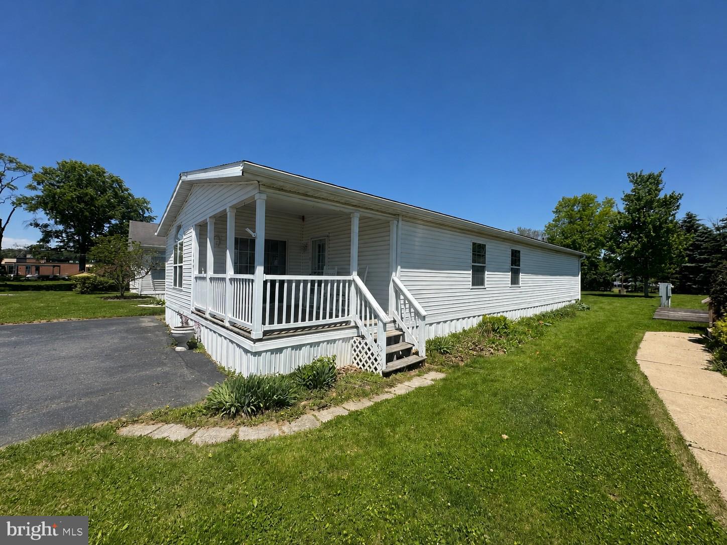 Double wide in Valley View Park.  Nice covered front porch and sunroom.  Spacious living room and bedrooms.  Primary bedroom has private bath and walk in closet.  Backs to community playground.  Offstreet parking.