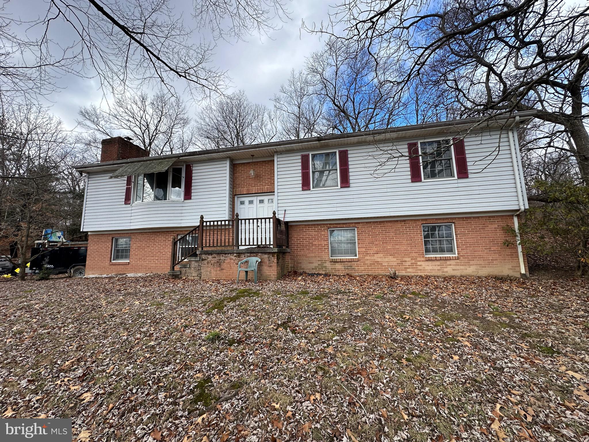 Check out this awesome 5 bedroom 2 bath split foyer located on the outskirts of Berkeley Springs. This home is conveniently located in between Martinsburg and Berkeley Springs. This home has 3 bedrooms on the main floor and 2 bedrooms in the basement along with washer and dryer hook ups. Both bathrooms are on the first floor. Home does need a little bit of TLC but that allows you to make it your own! Awesome living room space with a semi open concept into the dining room. Come check it out today!!