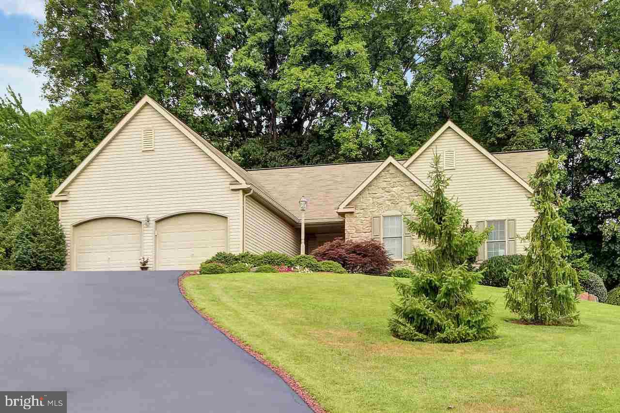 TRULY GORGEOUS HOME with 3,300SF of finished living area! Beautiful view from the front & a peaceful oasis in the back. Lovely Kitchen w/breakfast bar & glass doors leading out to patio & large deck   Great for entertaining! Arched doorways & a beautiful Stone Fireplace in Living Room. Master suite w/full Bath & huge walk-in closet. Outstanding Finished bsmt features a Family Room/Game Room, Full Bath w/Shower & a 4th BR/Office. A MUST SEE HOME!
