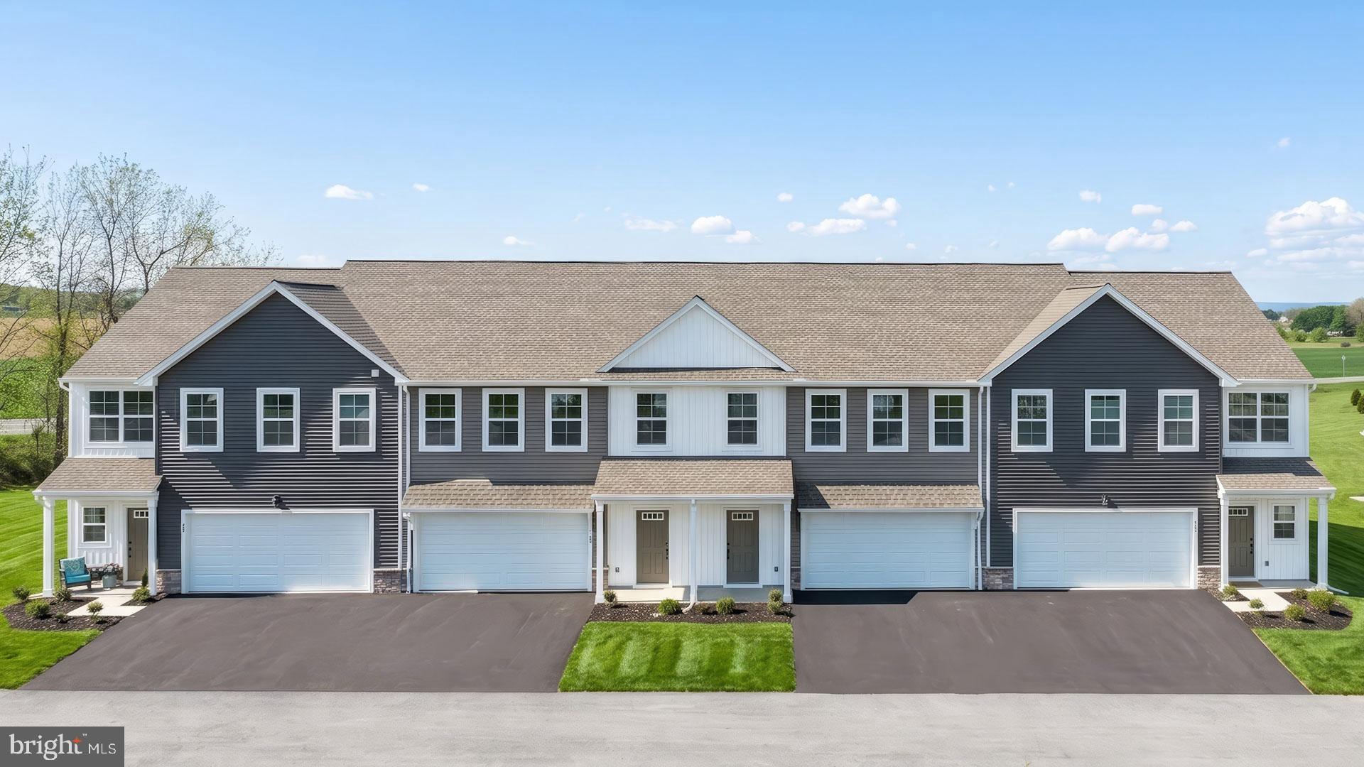 This 2-story townhome includes a 2-car garage, 9’ ceilings, and durable vinyl plank flooring throughout the first floor. The kitchen, featuring stainless steel appliances, quartz countertops, and a large center island, has sliding glass door access to the rear patio. Across from the kitchen is a spacious family room with an ample amount of natural light. The 2nd floor boasts an owner’s suite with an expansive closet and a private bathroom, 2 additional bedrooms, a full bathroom, and a convenient laundry room.