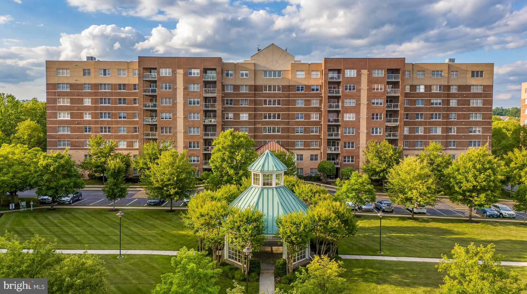 The space, updates, and location you've been waiting for in sought-after Roundwood Ridge Mays Chapel North. Perfectly positioned on the 5th floor overlooking the community gazebo, this beautifully updated condominium offers the ideal balance of privacy, views, and convenience.

Originally designed as a two-bedroom plus den floor plan, the wall between the primary bedroom and second bedroom was thoughtfully removed to create an expansive owner's suite rarely found in the community. The space can be easily converted back to its original two-bedroom plus den configuration should a future owner prefer. A separate den provides flexible space for a home office, guest room, or cozy retreat.

The white kitchen features dark granite countertops, stainless steel appliances, a center island, abundant cabinetry, and a spacious eat-in area anchored by a gas fireplace. A standout feature of the home, both full bathrooms have been beautifully remodeled with tasteful, modern updates!

One of the home's most valuable features is the peace of mind that comes with major system updates already completed, including a new HVAC system and hot water heater in 2025! Additional improvements include updated flooring, fresh paint throughout, crown molding, and an updated disposal, dishwasher, and microwave.

Completing the package is a designated garage parking space, secure building access, elevator convenience, storage cage, and a prime Mays Chapel location just moments from shopping, dining, walking paths, and commuter routes.

Move right in and enjoy the comfort, convenience, and extensive updates this exceptional home has to offer!