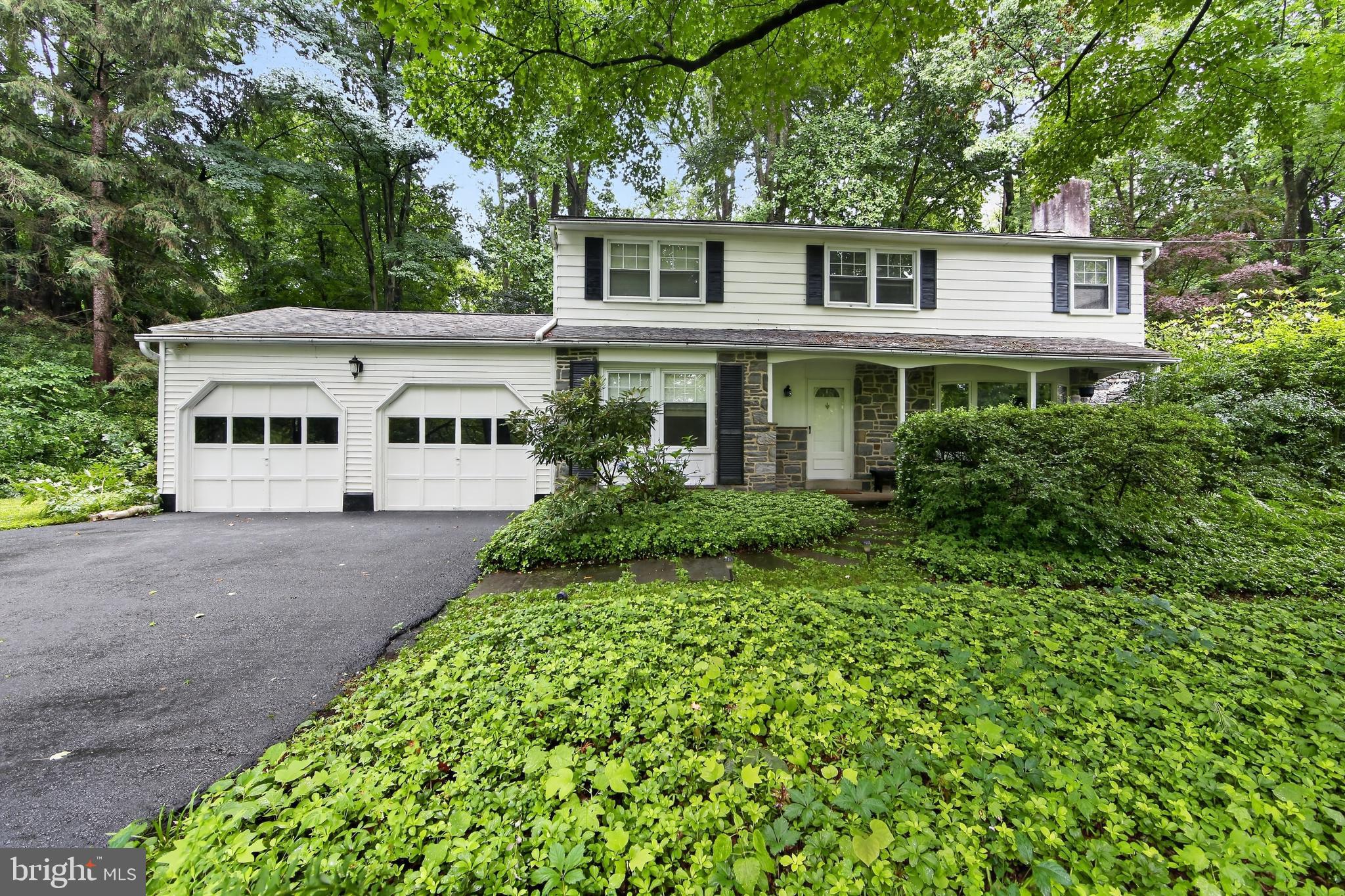 Beautifully situated on a picturesque wooded lot in the highly desirable community of Rose Valley, this exceptional 4 bedroom, 2.5 bath Two-Story Colonial offers a rare combination of privacy, tranquility, and timeless charm. Located on a quiet private street with virtually no through traffic, this home provides a peaceful retreat while being part of the Wallingford-Swarthmore School District. Adding to its exceptional setting, the home sits directly across the street from the 13-acre Chadwick Wildlife Preserve-protected
wooded open space with walking trails right at your doorstep. A welcoming center hall entrance opens to a sun-filled living room featuring hardwood floors, an oversized bay window, and a classic wood burning fireplace, creating a warm and inviting space for relaxing and entertaining. The formal dining room is highlighted by a large picture window overlooking the serene backyard, providing the perfect backdrop
for gatherings with family and friends. The spacious kitchen offers abundant cabinetry, generous counter space, and a breakfast peninsula with seating, making it ideal for everyday living and entertaining. Just off the kitchen, the comfortable family room features access to the attached two-car garage and sliding doors leading to a covered patio and outdoor entertaining area, an ideal setting to enjoy the peaceful wooded surroundings. A private first floor office provides the perfect work-from-home space, while a convenient powder room completes the main level. Upstairs, the spacious primary suite features hardwood flooring, a large walk-in closet, additional closet space, and a private en-suite bathroom. Three additional generously
sized bedrooms offer ample closet space and share a well appointed hall bathroom. A large linen closet provides additional storage and convenience. Additional highlights include hardwood floors throughout much of the home, an attached two-car garage, and a full unfinished basement offering endless possibilities for storage, hobbies, or future finishing. Ideally located directly across from the 13-acre Chadwick Wildlife Preserve and near Rose Valley trails, parks, train stations, shopping, dining,
Media borough and major commuting routes, this home offers the perfect blend of comfortable living, natural beauty, and an exceptional location.