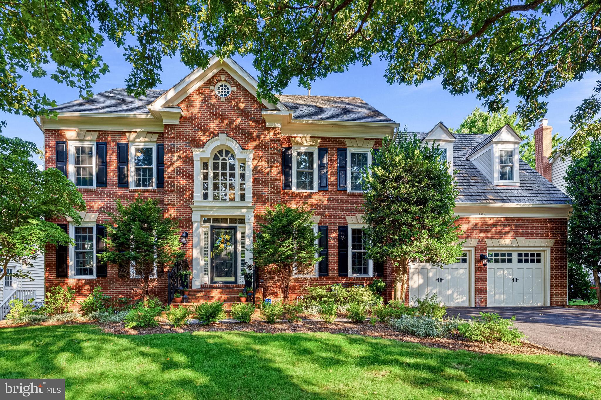 Set in the sought-after Woodlea Manor neighborhood, this stately brick-front Wetherburne Westover model offers approximately 4,470 finished square feet, including 3,420 square feet above grade and an additional 1,050 finished square feet in the lower level. Known for its spacious and highly desirable floor plan, the home combines generous living areas, thoughtful updates, and exceptional indoor and outdoor spaces.

The updated kitchen opens naturally to the main living areas, creating an easy flow for both everyday living and entertaining. Hardwood flooring was extended into the family room in 2022, adding warmth and continuity to the main level. Generously sized rooms, three full bathrooms on the upper level, and a finished lower level with an additional full bath provide flexibility for guests, recreation, working from home, or multigenerational living. The basement was further enhanced in 2025 with luxury vinyl plank flooring throughout, additional lighting, and dimmer controls.

Outdoor living is a true highlight. A massive screened porch overlooks the beautifully manicured backyard and connects to a stone patio, creating an inviting setting for outdoor dining, entertaining, or relaxing throughout much of the year.

The home has also benefited from a substantial list of improvements. The heating and cooling systems were replaced and upgraded in 2020, along with most of the home’s windows, exterior painting, a new front storm door, and replacement gutters with leaf covers. Privacy window treatments were upgraded in 2021, along with new bathroom vanities in both the primary bath and secondary bath. Additional improvements include a replacement kitchen hot-water dispenser system in 2022, a new garage door opener and spring in 2024, driveway sealing in 2024, a new mailbox and post in 2024, and repairs to the lower-level fireplace in 2024. Both gas fireplaces were professionally serviced in 2025.

Woodlea Manor is one of Leesburg’s most established and desirable neighborhoods, known for its attractive streetscapes, mature landscaping, spacious homes, and strong sense of community. Residents enjoy access to neighborhood amenities that include an outdoor swimming pool, tennis courts, walking trails, playground areas, and inviting common spaces. The community offers the space and setting of a traditional suburban neighborhood while remaining remarkably close to everything Leesburg has to offer.

Historic downtown Leesburg is only minutes away, placing locally owned restaurants, coffee shops, boutiques, breweries, community events, and the town’s vibrant historic district within easy reach. Residents can enjoy dinner downtown, browse the shops along King Street, visit the farmers market, or attend one of Leesburg’s many seasonal festivals without a lengthy drive.

The location also provides convenient access to Route 7, Route 15, the Dulles Greenway, and other major commuter routes, making travel toward Ashburn, Reston, Tysons, Dulles International Airport, and the broader Northern Virginia region straightforward. With its desirable Westover floor plan, extensive updates, impressive outdoor living spaces, and exceptional Woodlea Manor setting, this home offers a rare combination of space, comfort, and convenience.