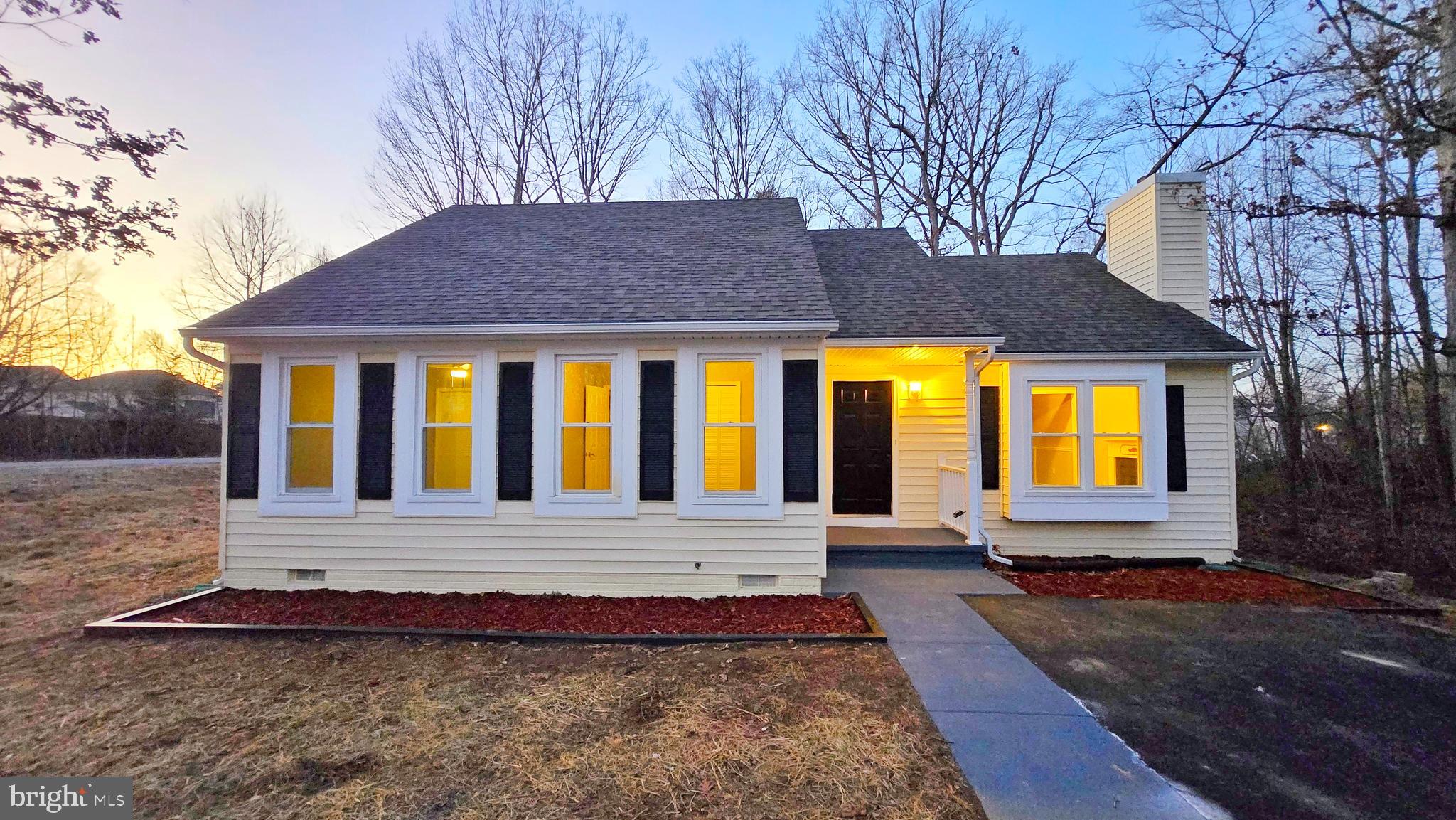 Welcome to this stunning, fully renovated home situated on a spacious, flat lot. Offering 3 bedrooms and 2 full bathrooms, this home boasts a bright, open layout with a generous living room and family room, both featuring gleaming hardwood floors and a cozy fireplace. The kitchen has been beautifully updated with quartz countertops and brand new white cabinetry, complemented by brand-new stainless steel appliances. Freshly painted and polished throughout, this home also includes a new washer and dryer, as well as a brand-new HVAC system. The large windows allow natural sunlight to fill every room, creating a warm and inviting atmosphere. The meticulously landscaped yard backs up to peaceful trees, offering privacy and tranquility. Conveniently located near all city amenities, just minutes from the marketplace and I-95.