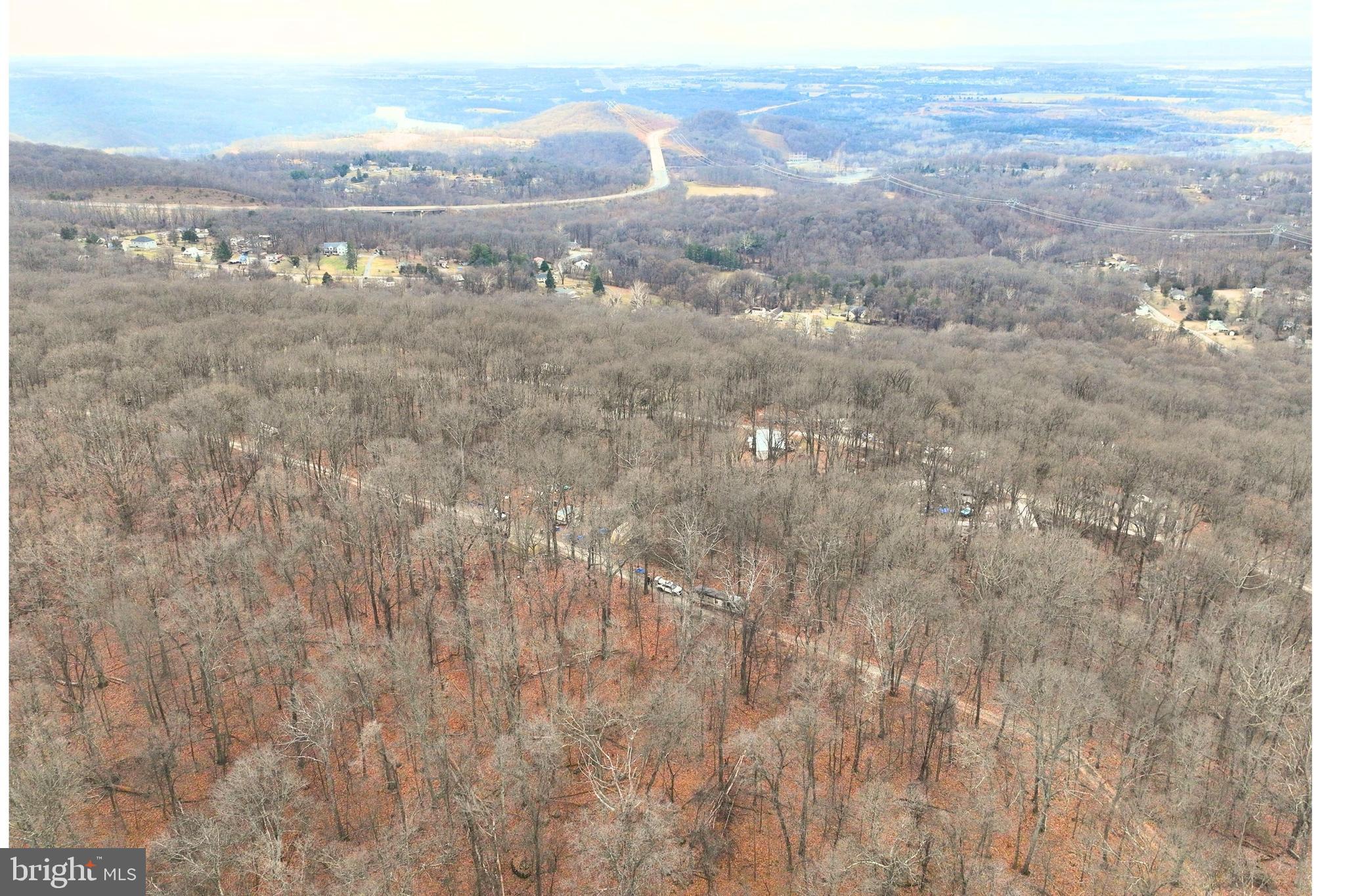 Enjoy mountain views from this elevated half acre lot at the top of the ridge on Hickory Nut Lane in Harpers Ferry, WV. This wooded parcel offers a private, scenic setting ideal for a future cabin, weekend getaway, or custom home. Located in a quiet, rural neighborhood with existing homes, the property offers potential for residential or recreational use. Gently to moderately sloped terrain provides natural character and privacy. Road frontage allows for straightforward access, and utilities appear available in the area based on nearby homes. Conveniently located near the Potomac River, Appalachian Trail, and just a short drive to downtown Harpers Ferry, shops, and commuter routes. A rare chance to own mountain-top land where West Virginia and Virginia meet!