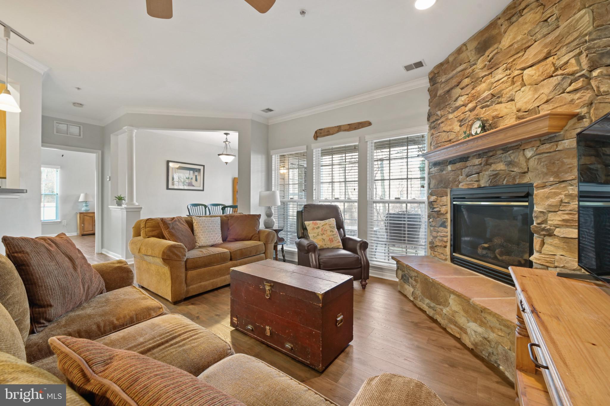 Rarely available 55+ condo in the heart of downtown Bel Air! This condo offers a private entrance in the back with a covered patio that overlooks the Ma & Pa Trail. As you enter you will notice the open floor plan with recently updated engineered hard wood floors throughout and a beautiful stone gas fireplace. The kitchen includes a rolling island, newer stainless steel appliances and an over-sized pantry. Speaking of over-sized is the primary bedroom with two large closets. The other end of the condo brings a 2nd bedroom with access to the 2nd bathroom. It will be hard not to immediately fall in love with everything that you could possibly need within walking distance such as, Independent Brewing, ShopRite and all that Main Street has to offer in Bel Air!