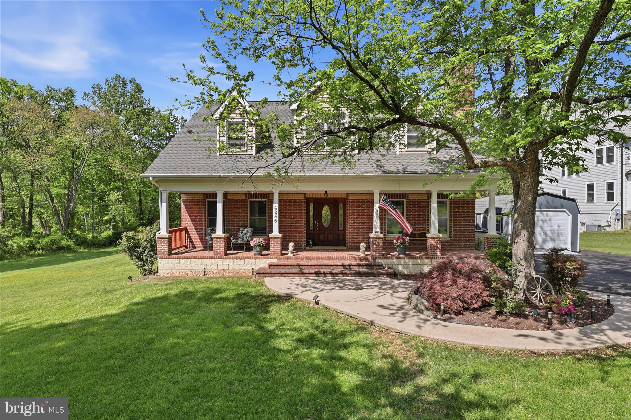Must-see ,beautifully built all-brick, Colonial with Cape Cod influences, perfectly sited on a private 1.45-acre property (1.45 includes adjoining 0.71-acre lot conveys*). Terrific location in Fairfax Station with no HOA.  Meticulously maintained with clear pride of ownership inside and out.  Well-designed floor plan offers main-level bedroom with en-suite bath—ideal for multigenerational living or guest suite. Updated kitchen features quartz countertops, stainless steel appliances, and seamless access to outdoor entertaining spaces. Upper level includes a versatile loft and a spacious primary suite with private balcony, walk-in closet, and bath with jetted tub and separate shower. Secondary bedroom features vaulted ceiling and dormer detail. Fully finished walkout lower level includes rec room with custom bar and second fireplace, fourth bedroom, full bath, and additional storage. Backyard designed for entertaining with Gunite pool (updated filter and app-controlled variable-speed pump), stone patio, and shed. Extensive recent updates. Freshly paved driveway with two additional parking spaces plus a brand-new 1-car Dutch Barn garage. Newly finished hardwood floors, and full interior repaint (2026). Major systems: roof replaced July 2024; HVAC (main/basement 2019, upper 2024); septic tank and distribution field 2021; well 2014; Leaf Filter gutter guards with lifetime warranty. Additional features include outdoor security system and VDOT-maintained dead-end street (snow removal).
Ideally located in Fairfax Station, this home offers privacy while remaining close to everyday conveniences including shopping, dining, and major commuter routes. Enjoy easy access to the Burke Centre Virginia Railway Express Station, just a short drive away, as well as nearby destinations like the Historic Town of Clifton and Burke Lake Park—offering the perfect blend of tranquility, accessibility, and lifestyle.
*Includes adjoining separately deeded 0.71-acre lot which conveys with the purchase of the home. The address for the lot is 10900 Woodfair Road.  As the lot sits undeveloped, annual taxes are $300 a year. Once permitted for a home build, taxes are commensurate with the size home built on the property in accordance with Fairfax County's tax authority.