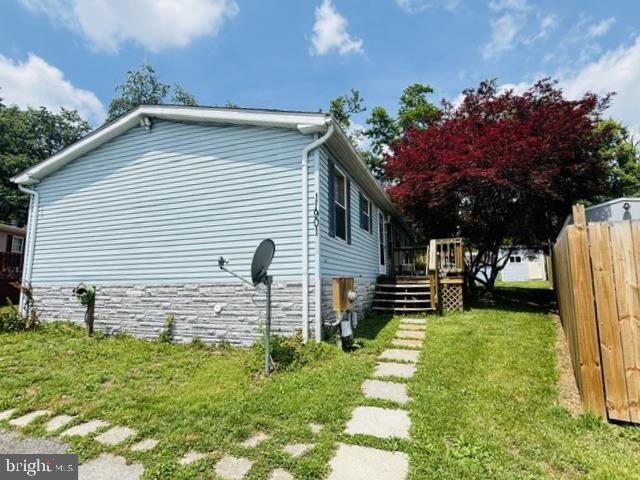 Single family 3 BR, 2 BA home in Highland Manor! On the very end cul-de-sac, BIG screened in porch on rear, includes 3 sheds! Over 1300 sq ft offers central Living Room with built-in entertainment wall, separate Dining Area, Eat-in Kitchen with Stove, Refrig, Microwave, Dishwasher and Disposal and ample cabinets. Laundry is in a separate space...washer and dryer included. On one end is the Primary Bedroom with Primary Bath and a Walk-in Closet. On the other end is 2 more Bedrooms and the main Bath. Affordable living on one level...lots of potential! Prior to recent inheritance, ONE owner since it was built. Roof was replaced in 2020. HWH about 7 yrs old.  Property being sold AS-IS.