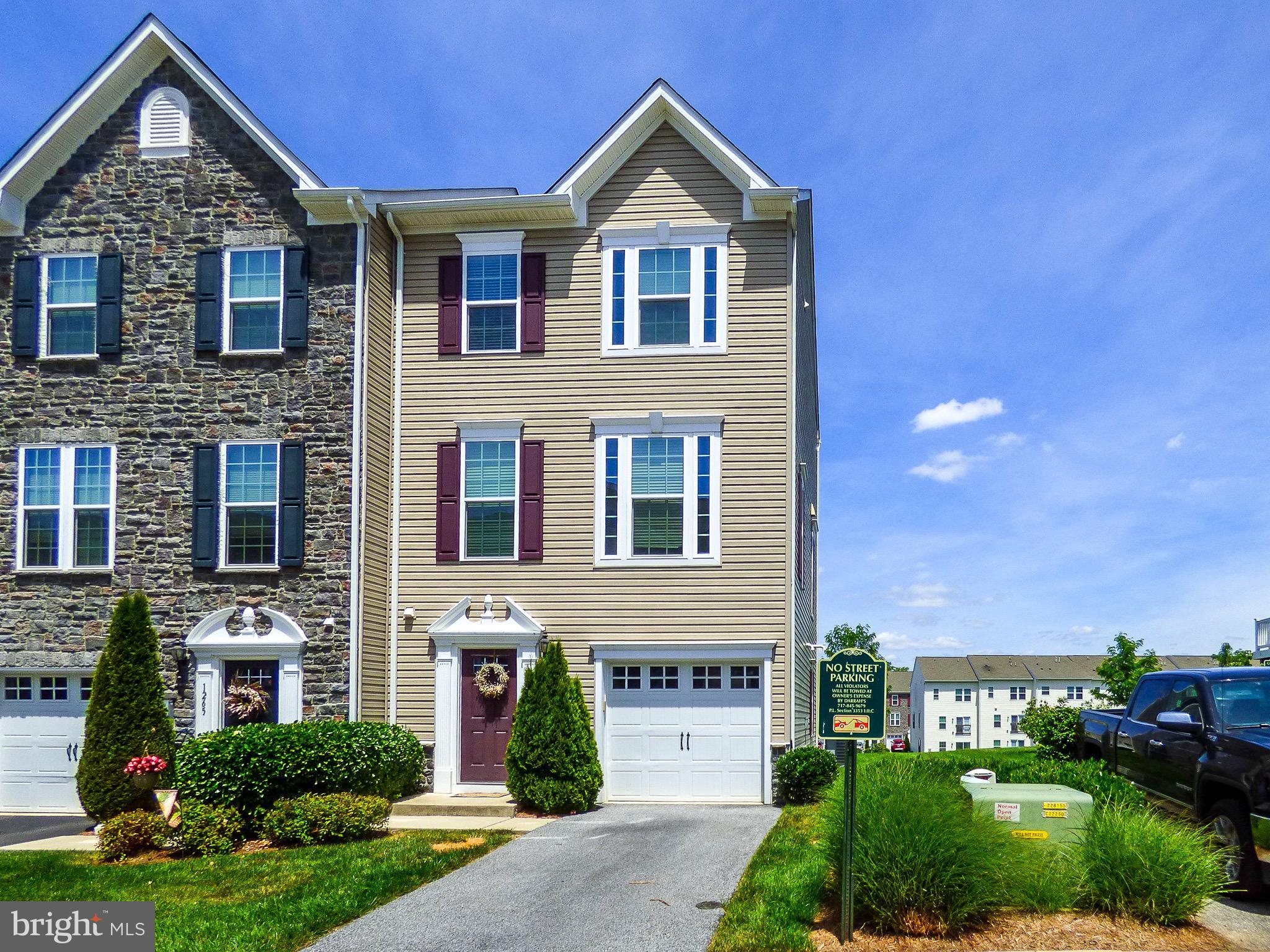 Holy Cow!  Check out this brick & vinyl 3 story end unit condo in Stone Gate in the Regent’s Glenn community!  York Suburban Schools &  even closer to York Country Day School.  Built in 2015 & in good condition - this unit is immediately next to overflow guest parking & backs to the large grassy common area!  You’ll love the granite counter top with stainless steel appliances, the open airy floor plan with tons of light & gable end windows, the master bedroom with a master bath & it’s own deep walk in closet, the 3rd floor laundry & the great view of the rear grassy common area.  1 car attached garage is fully finished with a painted epoxy floor too!  Live here & never worry about exterior maintenance, lawn mowing or snow shoveling ever again!  Call the listing agent regarding the possession date possible for this fine end unit condo.