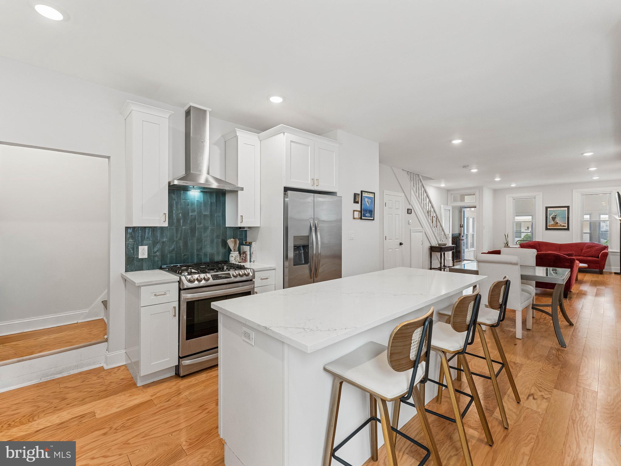 Welcome to 4241 Pechin Street, a fully renovated 4-bedroom, 2.5-bath twin home in the heart of Roxborough, just minutes from Manayunk’s restaurants, shops, and trails. Spanning approximately 1,856 square feet across three finished levels, this move-in ready home blends modern updates with classic Philadelphia charm. A bright and spacious front sunroom/foyer offers a warm welcome and flexible bonus space, while the charming vestibule preserves the home’s historic character as it leads into the open-concept main level. The first floor features hardwood flooring, a spacious living and dining area, convenient first-floor laundry, and an updated kitchen with white shaker cabinetry, quartz countertops, stainless steel appliances, gas cooking, and a large center island with breakfast bar. Just off the kitchen, a convenient half bathroom and main floor laundry center, along with the private rear fenced yard and patio provide the perfect setup for relaxing, grilling, or entertaining. The second floor also features hardwood flooring and includes a spacious primary suite with a private en-suite bath, a second generously sized bedroom, an additional full hall bathroom, and butler stairs leading back to the kitchen. The third floor offers two more well-sized bedrooms, ideal for guests, kids’ rooms, or home office space. Additional highlights include central air conditioning, natural gas heat, updated bathrooms with modern finishes, and a large partially finished basement offering great flexibility for storage, a gym, playroom, or extra living space. Located in one of Roxborough’s most convenient pockets, 4241 Pechin is close to neighborhood favorites like Hilltown Tavern, New Ridge Brewing Company, and Mia Ragazza, with easy access to Main Street Manayunk, Wissahickon hiking trails, regional rail, shopping, and major routes including I-76 and Route 1.