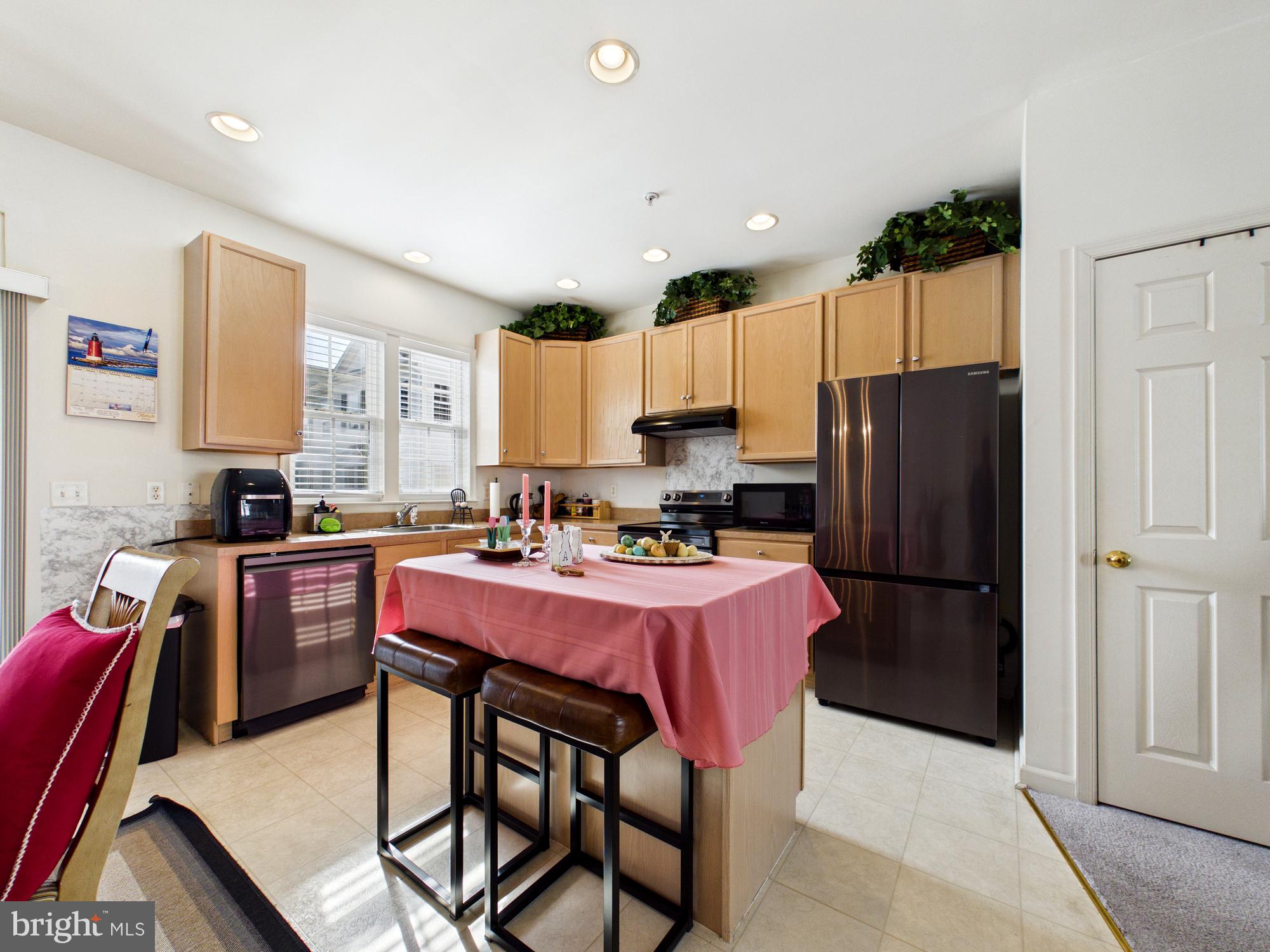 Spacious 1,788 sq. ft. home featuring a premium Samsung Black Stainless kitchen suite, integrated smart home technology, and high-efficiency Andersen upgrades.

Step inside and you’re greeted by a welcoming entry hallway with direct access to the garage—perfect for everyday ease and functionality. Upstairs, the home opens into a bright and airy main living level where natural light pours through, highlighting an expansive open-concept layout. The seamless flow between the living area and kitchen creates the ideal space for both relaxing and entertaining. The spacious 2-car garage is complemented by additional off-street parking, providing ample room for residents and guests alike.

The kitchen is a true centerpiece, featuring an island, generous cabinetry, and a dedicated breakfast area—perfect for casual mornings or hosting guests. This home is a tech-lover's dream, featuring a fully integrated smart-home ecosystem including a Ring doorbell, Nest thermostat, and MyQ smart garage—all controllable from your phone. The kitchen is anchored by a premium suite of Samsung Black Stainless Steel appliances (all included) and a newly installed range hood. With app-integrated connectivity throughout, this home offers a modern lifestyle that is truly move-in ready. Just beyond, step out to your private screened terrace, offering a peaceful retreat for enjoying coastal breezes year-round.

The upper level is thoughtfully designed for comfort and privacy, featuring three spacious bedrooms. The primary suite serves as a tranquil escape, complete with its own private bathroom, while additional bedrooms provide flexibility for guests, family, or a home office.

Beyond the home itself, residents of Fairfield at Long Neck enjoy a relaxed coastal lifestyle with access to community amenities including a swimming pool, all set within a convenient location near the Indian River Bay. The surrounding Long Neck area is rich with lifestyle appeal—offering walking paths, nearby marinas, local dining, and easy access to beach destinations like Rehoboth and Lewes, all just a short drive away.

Whether you’re searching for a full-time residence or a coastal getaway, this home delivers the perfect blend of low-maintenance living, modern comfort, and proximity to everything that makes Delaware beach living so desirable.
