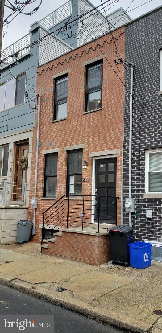 Beautifully renovated home on a quiet street in Point Breeze! Enjoy a spacious living room with tall ceilings, modern LED lighting, and contemporary flooring. The sleek kitchen features gray shaker cabinetry, stainless steel appliances, granite countertops, and a stylish tile backsplash. Relax in the private, low-maintenance backyard or the finished basement with high ceilings and a powder room. Upstairs, find two spacious bedrooms and a luxurious full bath. Convenient main-floor laundry. Prime location near Passyunk Square, Broad Street subway, Lincoln Square, and Wharton Square Park. Schedule your showing today! Tenant pays utilities, including a $60 water fee. All square footage numbers are approximate and should be verified by the buyer. It is the responsibility of the buyer to verify real estate taxes.