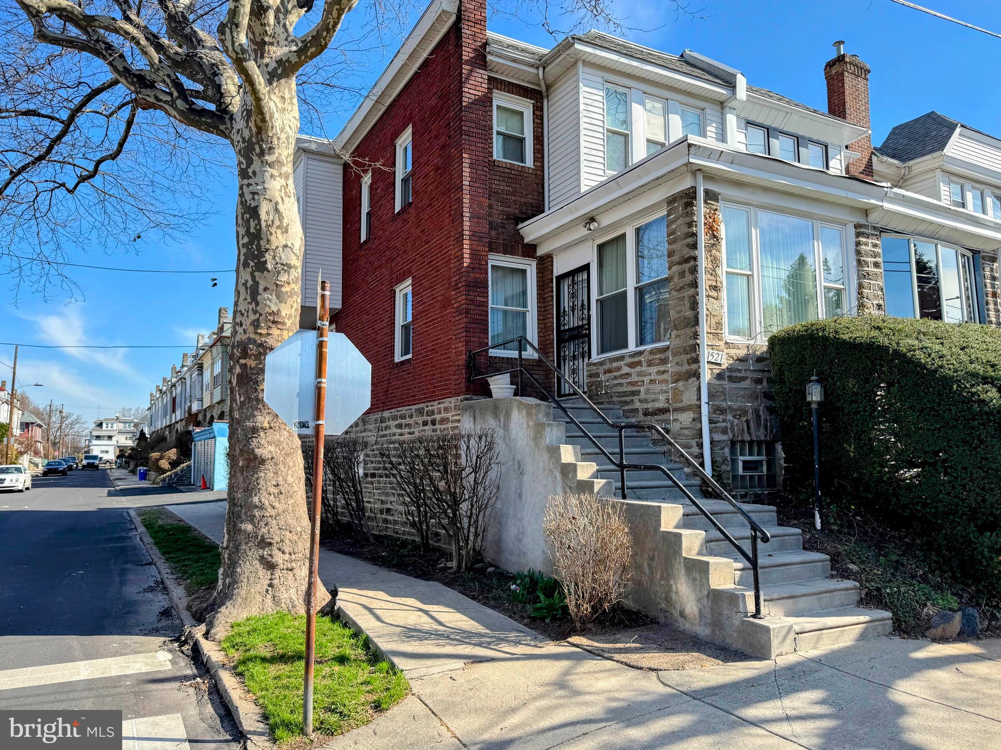 This beautiful and well-maintained two-story end-row home welcomes you through a sun-drenched sunroom into a spacious living area, a bright dining room, and an eat-in kitchen, with original hardwood floors believed to be underneath the carpet and mostly updated windows offering built-in savings. Upstairs features three generously sized bedrooms and a full four-piece bath, while the expansive basement includes a convenient quarter bath and a separate entrance. Complete with off-street rear parking and a private garage, this property is ideally located just steps from public transportation. Being sold strictly "as-is, where-is" as an Estate Sale (inspections for informational purposes only), this home sits next door to a property that recently sold for $333k, presenting an incredible opportunity to build instant equity with a little TLC or to serve as a lucrative addition to any investment portfolio.