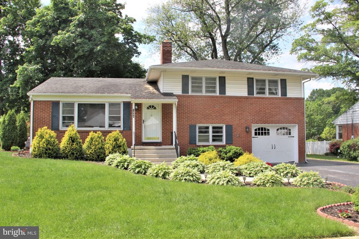Don't miss out on the chance to own this move in ready home.  This home is very spacious and includes a formal living room, formal dining room and eat in kitchen on main level.  3 bedrooms with hardwood floors and bath on upper level.  Lower level features finished family room with gas log fireplace.  Basement has a 4th bedroom,  a full bath and laundry room.  1 Car attached garage plus extended driveway for extra parking.  Backyard is fenced.