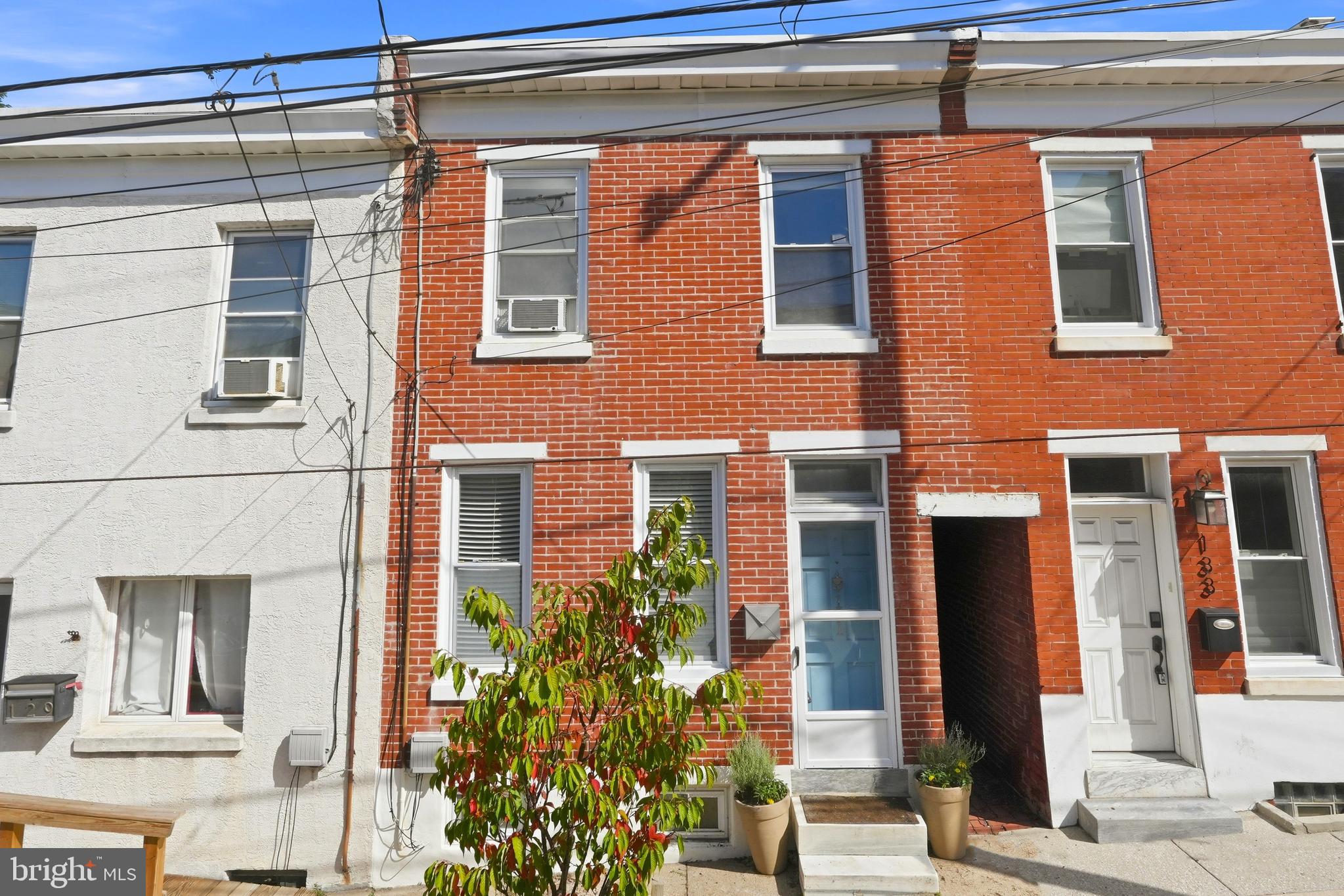 They say you cant have it all in Philly, but clearly “they” haven’t stepped foot inside 131 Dawson Street! Located in the highly sought-after Wissahickon neighborhood, this home is a beautifully updated 2 BD/1.5 BA row home that couples contemporary luxury with cozy, minimalist charm. From classic vinyl plank flooring and LED recessed lighting to an open kitchen and grassy backyard, this home has been outfitted with refined taste. The first floor boasts a divided living and dining area that flows into the airy, white kitchen. The kitchen features white shaker cabinets, antique brushed brass hardware, a tile backsplash, cabinet storage, and stainless steel appliances. In the warmer months, the home transitions seamlessly to the private rear deck and yard, perfect for morning coffee or summer grilling (and someone with a green thumb). A convenient powder room and laundry area complete the first floor. The second floor features two sizable bedrooms, a hallway bathroom, and a walk-in hallway closet. The basement is equipped with ample storage. EASY residential street parking. Steps from Dottie’s Donuts, Unity Java, The Landing, Lark, C+C Creamery, and all of Main Street’s eateries. A short walk to the Wissahickon Valley trails. Minutes from the Septa, I-76, I-95, and the Philadelphia International Airport!