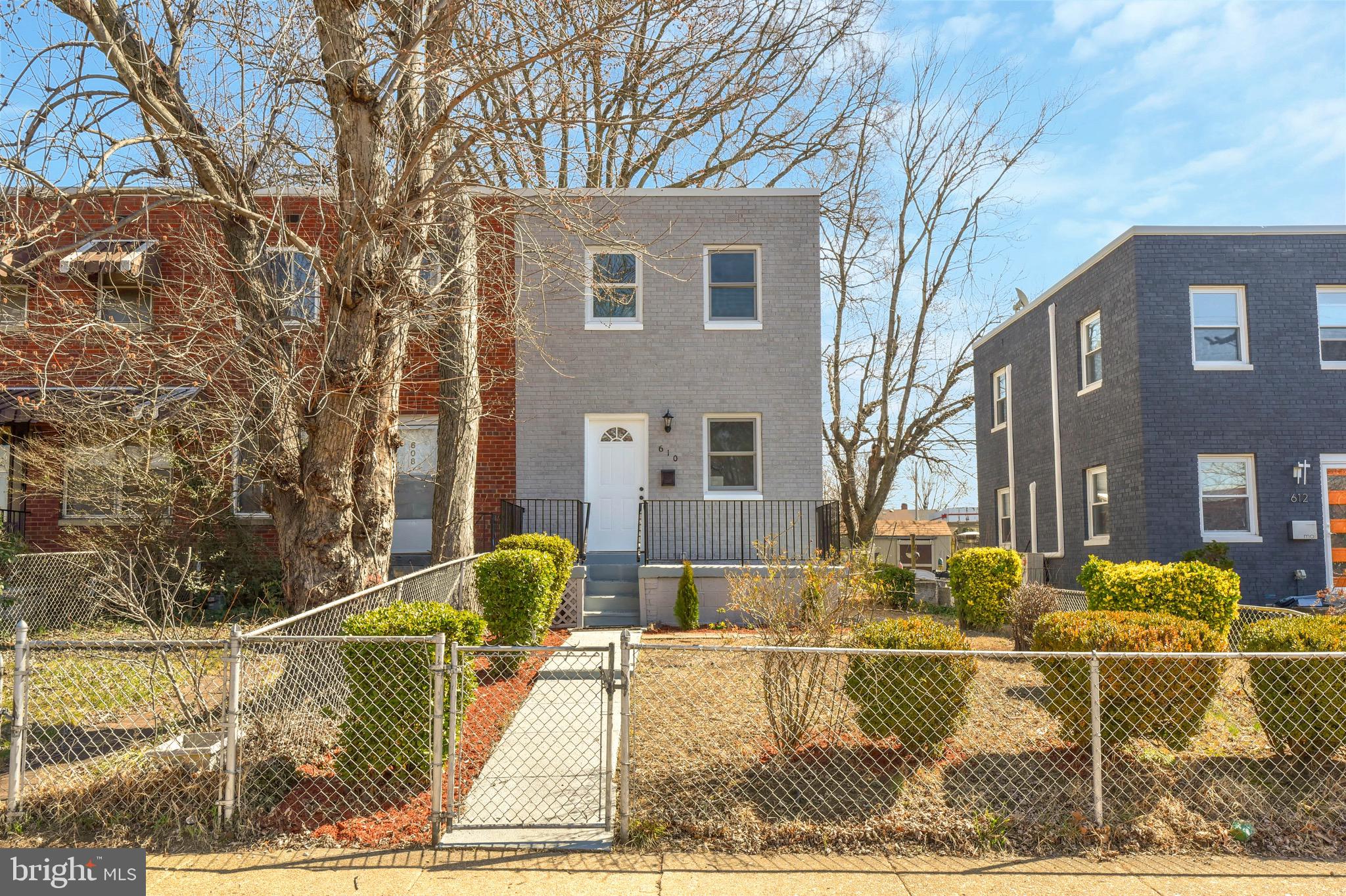 Welcome to 610 S Henry Street - a beautifully updated, move-in-ready end-unit townhome in the heart of Old Town Alexandria! This 3 level gem offers 2 bedrooms, 2 full baths, and a thoughtfully designed open floor plan that blends style and functionality. Step inside to find freshly painted interiors, gleaming hardwood floors, and recessed lighting throughout. The gourmet eat-in kitchen is a showstopper, featuring white shaker cabinets, granite countertops, stainless steel appliances, a large island with pendant lighting, and a breakfast bar - perfect for entertaining! A door off the kitchen leads to the rear deck, creating an ideal space for morning coffee, outdoor dining, or simply unwinding. Just off the kitchen, the spacious living area invites you to relax and unwind. Upstairs, you'll find two generously sized bedrooms, both with ceiling fans, and a lavishly updated hallway full bath. The walk-out lower level boasts a versatile recreation room, an additional full bath, and easy access to outdoor space. Private rear parking adds to the convenience - an incredible bonus in Old Town! Enjoy your inviting front porch, the perfect spot to sit and take in the charm of the tree-lined street. Whether sipping coffee in the morning or relaxing in the evening, this space enhances the home’s warmth and appeal. Unbeatable Location! Walk to all that Old Town has to offer - quaint shops, top-rated dining, and historic charm! Enjoy proximity to the waterfront, Mount Vernon Trail, and local parks. Commuters will love being just minutes from the Beltway, Metro, Reagan National Airport, and the Pentagon. This is the perfect blend of modern convenience and historic charm. Don’t miss your chance to call this beauty home!