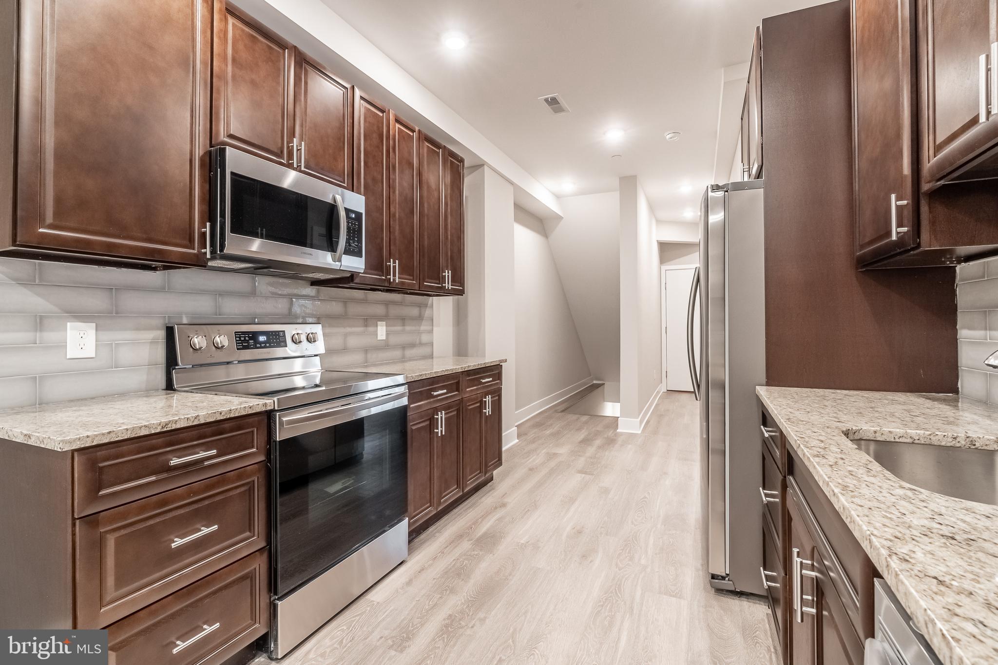 Welcome to this homey new construction near 39th and Lancaster! This large 4 bed, 4 bath bi-level apartment welcomes you with a beautiful galley-style kitchen packed with all modern amenities: a stainless steel stove, dishwasher, sink, and refrigerator (with ice and water)! As you walk through the kitchen, you?re brought to the nicely sized living area with a large flat-screen TV included! Just off of the living area is the exit to the private patio area. Here you can enjoy the beautiful Philly weather and BBQ with your friends and family! Each of the four-bedroom is generously sized, with accompanying closets and bathrooms! Recessed lighting and beautiful hardwood lines this luxurious apartment. Another amenities included is a video intercom system, built so you can greet your guests from the comfort of your apartment. Though high-speed internet IS included with the rent, the tenant is responsible for paying electric and a flat fee of $45/mo for water. Available NOW, this gorgeous apartment will not last long? contact Philly Home Advisors today!