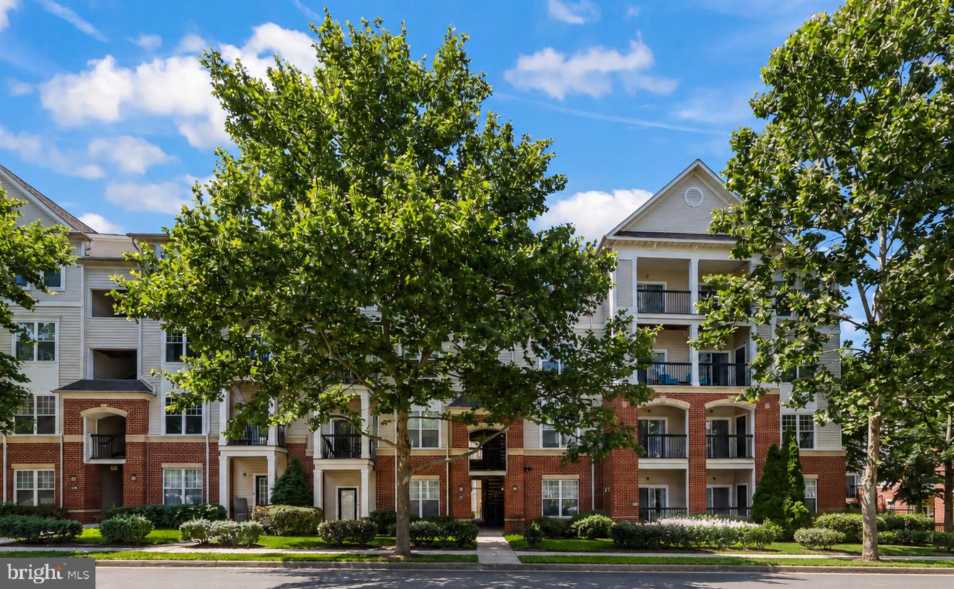 Welcome to luxury penthouse living in one of Fairfax’s most desirable gated communities. This beautifully updated 3-bedroom, 2-bath condominium offers 1,332 square feet of thoughtfully designed living space, combining comfort, privacy, and convenience in an unbeatable location. Perched on the top floor and surrounded by mature trees, this move-in ready residence provides a peaceful retreat while remaining moments from everything Fairfax has to offer. The open concept floor plan features high ceilings, abundant natural light, fresh paint, updated lighting, caulking and a spacious living area centered around a gas fireplace. The contemporary kitchen opens seamlessly to the living and dining spaces and showcases granite countertops, a breakfast bar, stainless steel appliances, and a newer dishwasher perfect for both everyday living and entertaining.

The spacious primary suite offers a private sanctuary with a large walk-in closet and updated en-suite bath featuring a new vanity and mirror. Two additional bedrooms provide flexibility for guests, a home office, or growing households, and each bedroom features its own walk-in closet; a rare and highly sought-after feature. Step outside to your private balcony overlooking the community park and tree-lined views, with multiple access points creating a seamless indoor-outdoor lifestyle. Additional improvements include a newer tankless water heater, newer HVAC system, serviced gas fireplace, updated bathroom vanities and mirrors, and two assigned parking spaces.

Residents enjoy resort-style amenities including a clubhouse, fitness center, outdoor pool, business center, media room, and game room. Ideally located near Fair Oaks Mall, Fairfax Corner, Costco, Wegmans, Whole Foods, H-Mart, premier dining, entertainment, and major commuter routes including I-66, Route 50, and Route 29. Offering the perfect blend of luxury, privacy, and convenience, this exceptional penthouse condo is the one you’ve been waiting for. Schedule your private tour today and discover why so many buyers love calling Fairfax home.