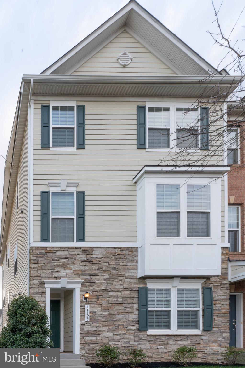 This extremely well maintained townhome has an entry level bedroom and full bath. Large family room down the hall with space for games and movie night. The main level has an open floor plan which includes living room, powder room, kitchen, and dining room. Very large deck off of the dining room is perfect for entertaining. Kitchen features upgraded cabinets and stainless steel appliances. Large pantry with plenty of room for a large family's needs. Upstairs are 3 bedrooms and 2 full baths. Master bedroom is large with tray ceiling and room for sitting area. Master bathroom features a large shower and double vanities.