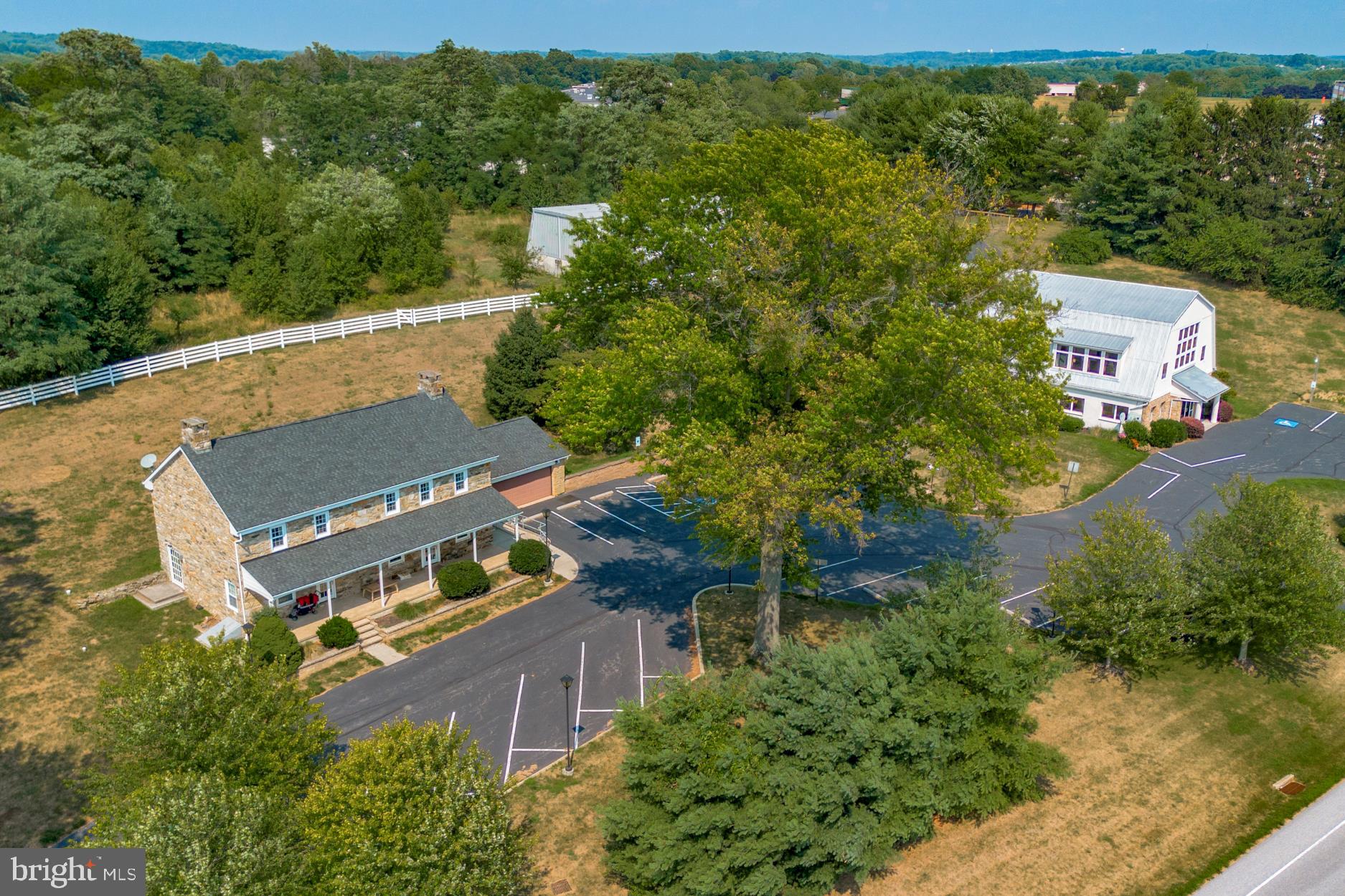 Presenting an exceptional investment opportunity with three distinct buildings on one expansive 7 acre lot. Together, the three buildings provide a total of 11,828 usable SF. Building 1, The Barn, offers 5,936 SF of versatile space, while  Building 2, The Farmhouse offers 2,872 SF. Both the Barn and Farmhouse buildings are currently leased as a daycare, offering stable rental income. The third building is a Warehouse with a total of 3,020 SF, which adds further potential for expansion or diversification of this investment portfolio. With an impressive NOI per year and an attractive CAP rate, this multi-building property presents a compelling proposition.
