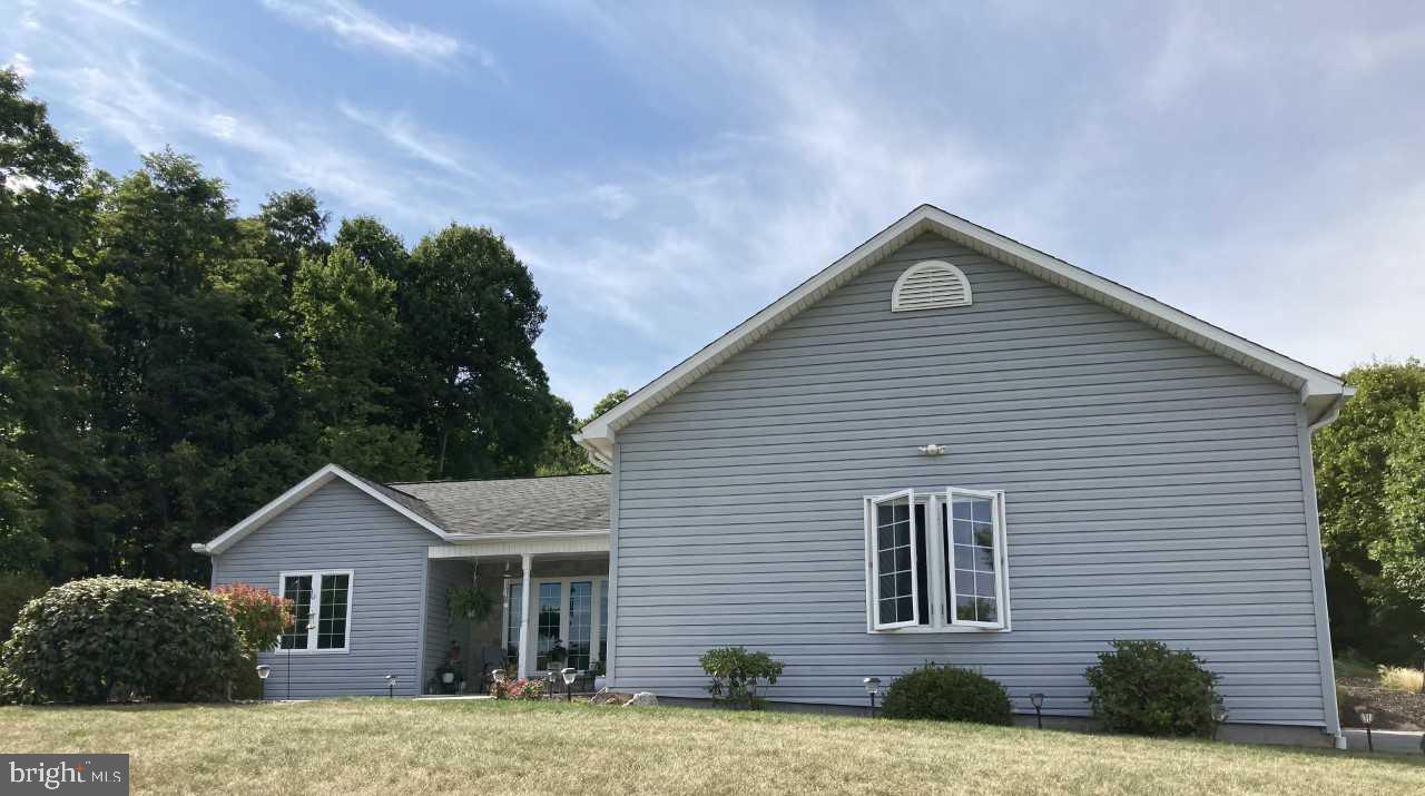 Welcome to 127 Mount Airy Drive! This BEAUTIFUL home sits on just under two acres with fabulous views. Meticulously landscaped with a ton of curb appeal. Two BR (which can easily be changed to three) 2 full baths. Paved base coat driveway. Large, covered deck. Two car attached garage plus a 12'X24' storage building. Heat pump (2021- Bosch) with auxiliary electric backup. You've got to see this one to appreciate all it offers. Approx three miles outside of the historic town of Bedford with close proximity to I99, 220 and the PA turnpike. Give me a call today!