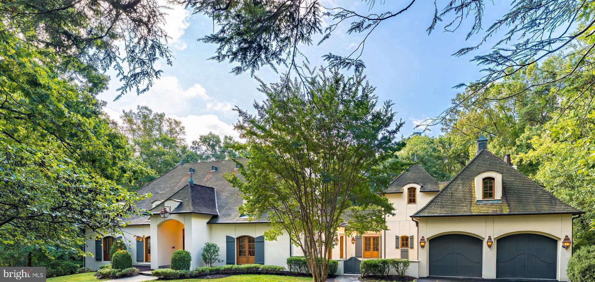 For Comp Purposes - Welcome to this elegant custom built French Country Manor designed by Jack Arnold AIA renowned architect of European and French Country Homes. This home is sited  on 5 beautiful  Acres with French Country Garden and fenced back lawn  Impressive hand laid Stone Fence and Columns greet you as you enter the grand circular driveway surrounding front lawn area. Stone walkway leads to impressive Portico entrance.  Expansive living room with tray ceiling,  gas fireplace, built-ins and French doors.  Elegant dining room with tray ceiing, cove lighting and two sets of French doors to spacious courtyard great for entertaining! Kitchen features beamed ceiling, center island, two sinks, dual ovens  and flows seamlessly into family room featuring vaulted beamed ceiling,  lovely stone  fireplace, view to French gardens plus French doors leading to deck. There are 4 main level bedrooms, spacious luxury Owner's suite with vaulted  beamed ceiling  and two sets of French doors leading to deck, luxury bath with jetted tub, two walk in closets with dressing area and custom built-ins.  Three additional bedrooms  2  en-suite  with  walk- in closets and 1 additional bedroom with full bath across the hall. All bedrooms have French doors to exterior. There is an elegant hallwaywith 5 sets of French doors leading to both stone tiled deck and front courtyard fantastic for entertaining! This same hallway  leads to exquisite library with custom built-ins, and stone fireplace. There is a spacious upper level great for office space, gym or playroom. There are two laundry rooms one on main level with sink and built-ins second one on lower level. Lower level features large recreation room with brick fireplace wall and billiard area with built-ins. You will find a spacious office/bonus  room with French doors to back gardens plus a door to the exterior leading to driveway.. Plus a full bath off this bonus room. There is a lovely lower level sunoom with Stone fireplace and French doors that lead to back yard and French gardens. Next you will find the arched ceiling hallway with beautiful tiled floor that will take you to the indoor Swimming Pool located in a beautiful room featuring a stone wall, sitting area surrounded  by windows and skylight, beautiful wood wall and French doors that lead to a cozy stone patio. This home has it all! Two garages spaces on main level and 2 garage spaces at lower level.