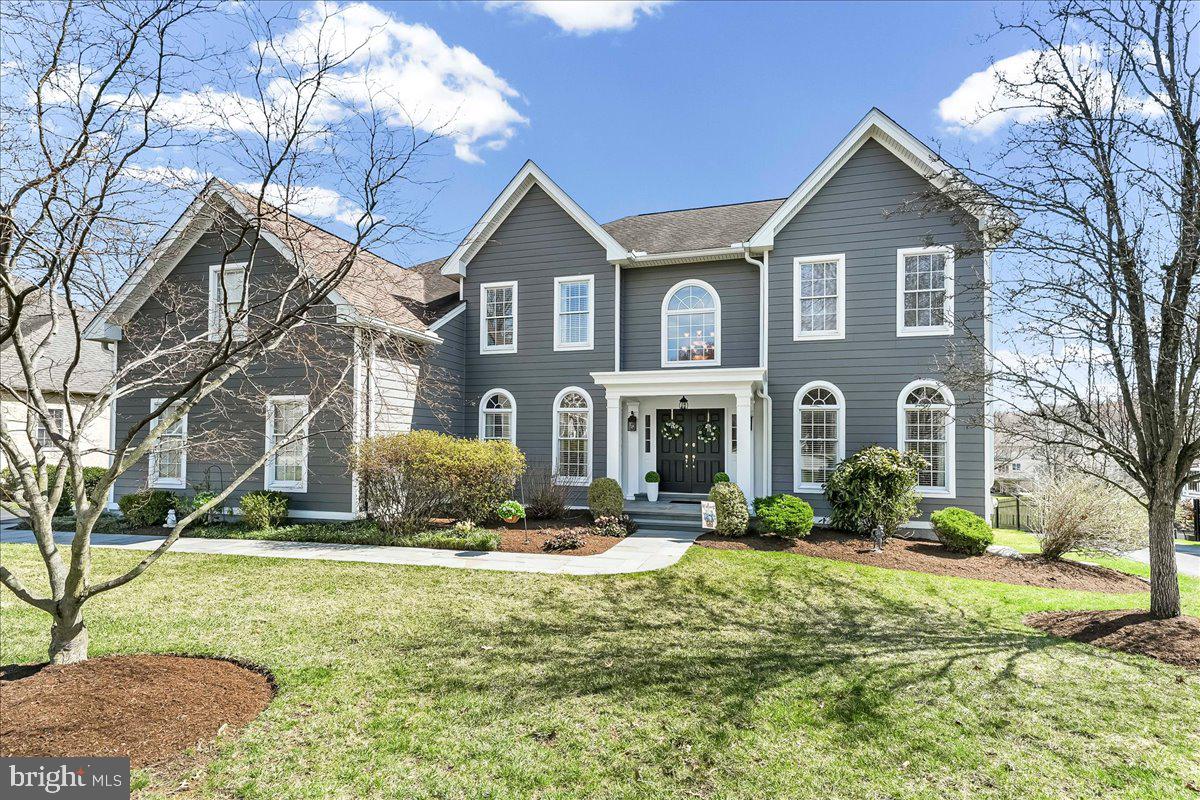 Welcome to an exceptional luxury residence in the sought after community of Garnet Valley Woods, located within the award winning Garnet Valley School District. Thoughtfully maintained and beautifully updated, this home blends timeless character with modern sophistication to offer comfort, elegance, and lasting peace of mind.
A welcoming front portico leads into a grand two story foyer featuring a vaulted ceiling, curved open staircase, and refined architectural details. Nine foot ceilings throughout enhance the home’s open, airy atmosphere. On either side of the foyer, the updated living room and formal dining room—each finished with crown molding and chair rail—create an ideal setting for both everyday living and elegant entertaining.
Just beyond, the expansive family room stands out with its raised hearth brick fireplace and dramatic Palladian arched windows that fill the space with natural light. An open balcony above overlooks both the family room and foyer, adding architectural interest and a sense of connection across levels.
The newly remodeled gourmet kitchen is designed for both function and style, featuring an oversized granite island, refreshed cabinetry, and a striking Italian inspired Fulgar Milano oven. There is ample room for casual dining, along with a spacious pantry for larger appliances. The kitchen flows seamlessly into a private conservatory—perfect for quiet mornings, relaxed evenings, or intimate gatherings. A convenient nook just inside the mudroom adds everyday practicality when entering from the garage.
Upstairs, the home offers four generous, light filled bedrooms and three full baths. The freshly painted and remodeled primary suite serves as a private retreat, complete with a walk in closet and a separate dressing/loggia area ideal for unwinding. Three additional bedrooms and two full baths, one of which is contained within a bedroom,  are thoughtfully arranged down the hall, providing comfort and privacy for family and guests. A rear staircase adds charm and convenience.
Significant updates provide added peace of mind, including newer Hardie board siding, gutters, and a recently installed HVAC system—making the exterior virtually maintenance free.
Set on a private lot backing to a scenic community trail, the property features extensive custom hardscaping that enhances both curb appeal and outdoor enjoyment. Step outside and unwind on the expansive, maintenance-free rear deck, ideally situated on the main level and overlooking a breathtaking open expanse of grass and field. Enjoy fresh air and an active lifestyle with access to the community’s scenic walking and biking loop. The outdoor living continues with a beautifully designed, decorator-inspired hardscaped lower patio-perfect for relaxing, barbecuing, hosting yard games, or simply escaping the warmth of the summer sun. This home truly offers exceptional indoor and outdoor living! The location offers exceptional convenience-close to top rated Garnet Valley schools, shopping, dining, athletic fields, and community amenities, with SEPTA rail access to Center City Philadelphia just five miles away.
Experience the warmth, convenience, and refined lifestyle of this friendly and highly desirable community and discover the place you’ll love to call home.