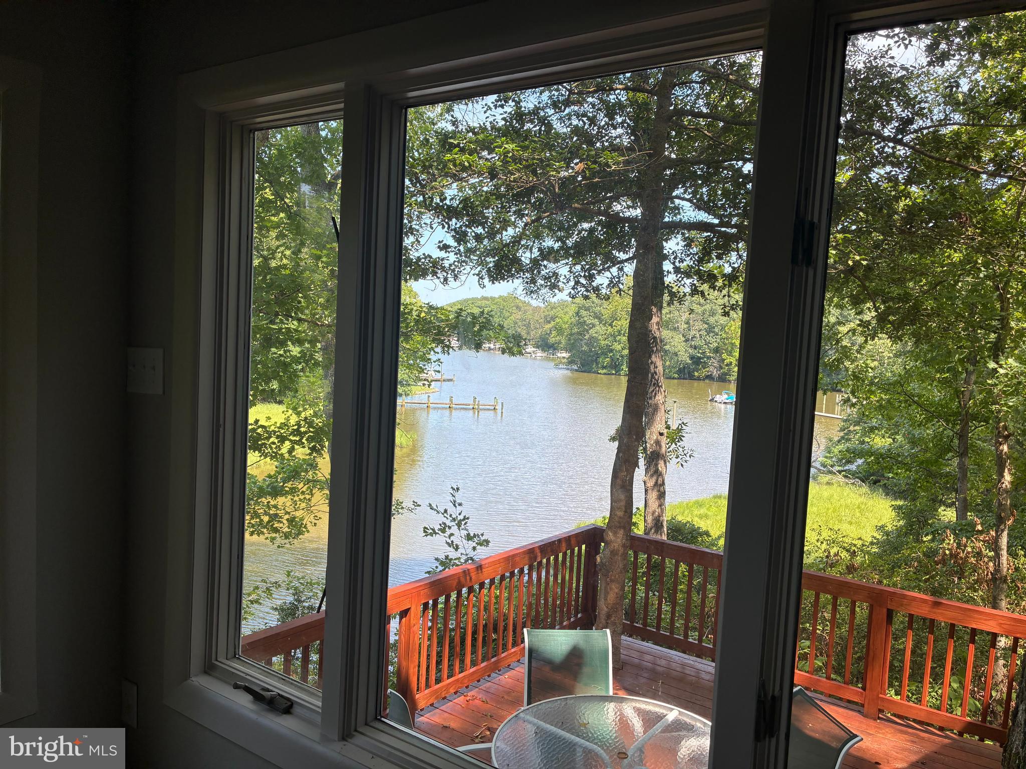 Welcome to Hickory Landing Waterfront property. The  tree-filled  private and quiet 17+ acre property is located on a cove off of Cuckold Creek. Experience breathtaking views from both the living room and the upper level, offering a perfect backdrop for daily living and relaxation. Chef's kitchen features custom solid maple painted  cabinets, providing timeless elegance and ample storage space for the discerning cook. This property was built in 1983 and expanded in 1990.  This is a rare parcel of land offering privacy and natural beauty. The home has views of the water and abundant wildlife. The 17+ acres and house are on mostly level land, the rest of the land is wooded with walnut, poplar,oak, maple and cypress trees which you can view down the long driveway to the house.  There is a pier on the property that is private for the neighbors use. There is 1 boat slip open. This water is good for a pontoon boat , Canoe,  shallow drafted boats. The pier is being redone in August 2026. The home is approximately 2,727Sq.Ft.  with 5 bedrooms and 3 baths. 2 outbuildings. NO HOA. Text listing agent for more information.