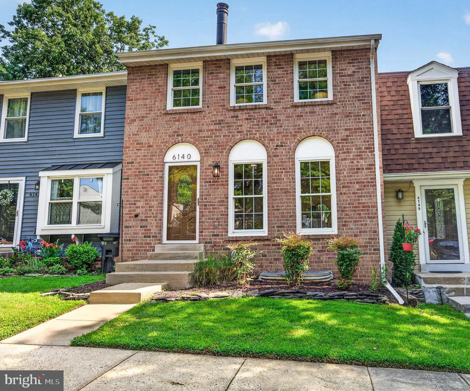 OPEN SUN, JULY 19 (12–2) Welcome to this beautifully updated three-level townhome nestled in the heart of Burke Centre, one of Burke's most established and sought-after communities. From the moment you arrive, you'll appreciate the inviting curb appeal, and once inside, you'll immediately feel at home.
The sun-filled main level offers an open, welcoming floor plan featuring hardwood floors, fresh designer chosen paint throughout, updated light fixtures, recessed lighting , and a dramatic floor-to-ceiling stone wood-burning fireplace that anchors the spacious living room. Every detail has been thoughtfully refreshed, creating a home that is truly turnkey.  The bright eat-in kitchen features white cabinetry, a tile backsplash, stainless steel appliances, a large pantry, and French doors that open to the rear deck, an ideal setting for morning coffee, outdoor dining, or relaxing after a long day. An updated powder room completes the main level.
Upstairs, the spacious primary suite offers a beautifully remodeled spa-inspired bath featuring a floor-to-ceiling tiled walk-in shower with a frameless glass enclosure, updated vanity, mirror, and designer lighting. Two additional generously sized bedrooms feature brand-new carpet and updated lighting, while the second full bath has been tastefully refreshed with a new mirror and lighting, giving the entire upper level a fresh, modern feel. The finished walk-out lower level provides exceptional versatility with a spacious recreation room featuring recessed lighting, custom built-in shelving, a wet bar, and an updated half bath. A separate office or flex room, laundry area, and abundant storage complete the space. Step outside to a private patio and fully fenced backyard, extending your living space and providing the perfect setting for entertaining, pets, or simply enjoying the outdoors.  Everyday convenience is unmatched with two reserved parking spaces directly in front of the home. Ideally located just minutes from Route 123, Fairfax County Parkway, shopping, dining, parks, and everyday conveniences, this home also offers access to all of Burke Centre's exceptional amenities, including pools, miles of scenic walking and jogging trails, tennis courts, playgrounds, and beautifully maintained green spaces.  Beautifully updated, impeccably maintained, and perfectly located, this exceptional Burke Centre home offers the ideal combination of comfort, style, and convenience. Opportunities like this don't come along often, don't miss your chance to call it home.