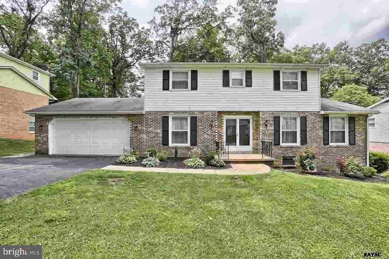 This Spacious Colonial in York Suburban Schools is sure to please. 4BR 2 1/2 bath home features updated kitchen with new stainless steel appliances, FR with Wood burning fireplace, Lower level walkout features spacious Den with wet bar PLUS a separate game room, screened porch & 2 car garage. Hardwood under carpet. 5 minutes to I-83, Rt 30 & Shopping.