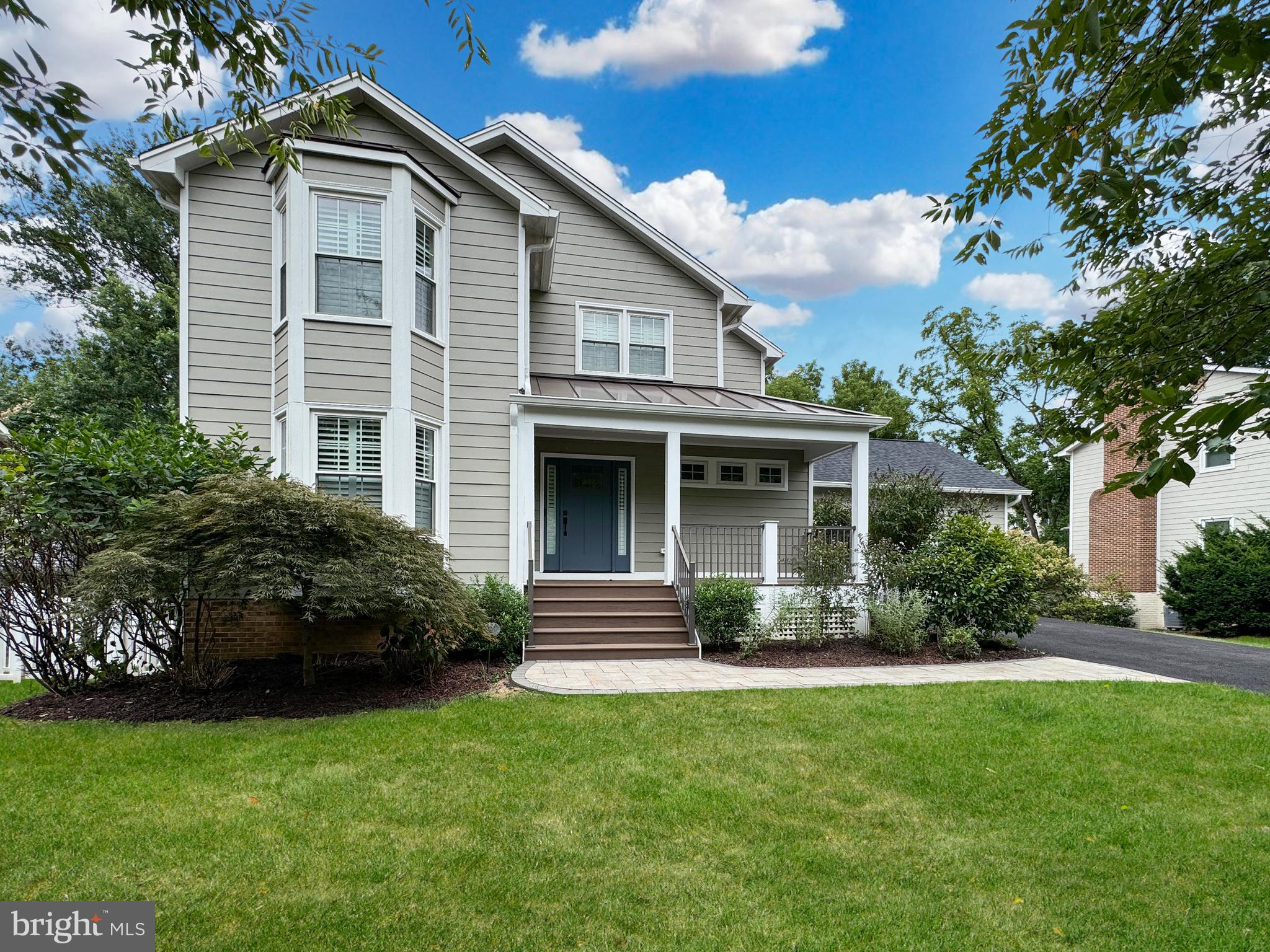***Food Truck and Catered Open Houses*** Catered Open House Friday (9/13) 6-8PM, Catered Open House Saturday (9/14) 12-2PM, and Food Truck Open House (9/15) Sunday 12-2PM - Welcome to your dream home nestled on a picturesque, quiet tree-lined street in the heart of Falls Church. This charming colonial-style home, with its classic architecture and modern upgrades, offers the perfect blend of comfort, elegance, and convenience.

As you approach the property, you’ll immediately notice the striking curb appeal, enhanced by the new Hardie Plank siding and a beautifully reconfigured front porch. Imagine sipping your morning coffee on this cozy porch, surrounded by the serenity of blooming trees and well-maintained landscaping. The new front walkway leads you directly to the inviting front door, setting the stage for the warmth and style that awaits inside.

Step through the front door, and you’ll be greeted by the stunning results of a full main level renovation completed in 2020. The brand-new hardwood floors gleam under the natural light that pours in through large windows, creating an open and airy atmosphere. The heart of the home is undoubtedly the kitchen—a space so beautifully designed, it could easily be featured in a magazine. The oversized island with pristine quartz countertops provides ample space for meal prep, casual dining, or simply gathering with loved ones. State-of-the-art stainless steel appliances, including a gas range, make cooking a joy, while the abundance of cabinet and counter space ensures everything has its place. And let’s not forget the walk-in pantry, offering additional storage and keeping the kitchen clutter-free.

The open layout seamlessly connects the kitchen to the dining and living areas, making it perfect for both everyday living and hosting gatherings. Whether it’s a quiet family dinner or a lively get-together with friends, this space adapts to your needs. There’s also a flexible office space at the front of the house that could easily be converted into a main-level bedroom, providing versatility for changing family dynamics.

Just off the kitchen, the mudroom is a practical touch, featuring two closets and easy access to the garage. The main level also includes a full bathroom with a custom-tiled shower—ideal for guests or as a future in-law suite.

Head upstairs to discover your personal sanctuary. The owner’s suite is truly enviable, featuring a charming bay window that fills the room with light, a separate sitting area perfect for a quiet read or morning meditation, and a spacious walk-in closet. The en-suite bathroom is a luxurious retreat with dual sinks set in granite counters, a soaking tub where you can unwind after a long day, and a glass-framed shower for a spa-like experience.

Two additional bedrooms on this level are generously sized, with large closets and easy access to the hall bathroom, which has been updated with new flooring, fixtures, and a shower/tub combo. For added convenience, the laundry is located on this level, making household chores a breeze.

The lower level is a versatile space that can be customized to fit your lifestyle. It’s perfect for a recreation room, home gym, or game room. With plush carpeting, recessed lighting, and large windows, this area is bright and welcoming. The walkout access to the fenced yard adds another layer of convenience, making it easy to transition between indoor and outdoor activities. A full bathroom on this level ensures that guests have their own space and privacy.

Situated less than a mile from the Falls Church Metro and minutes away from major commuter routes, shopping, and retail, you’ll have everything you need within easy reach.  It’s walking distance to Haycock Elem, 2m drive to Longfellow Middle, and  6m to McLean HS