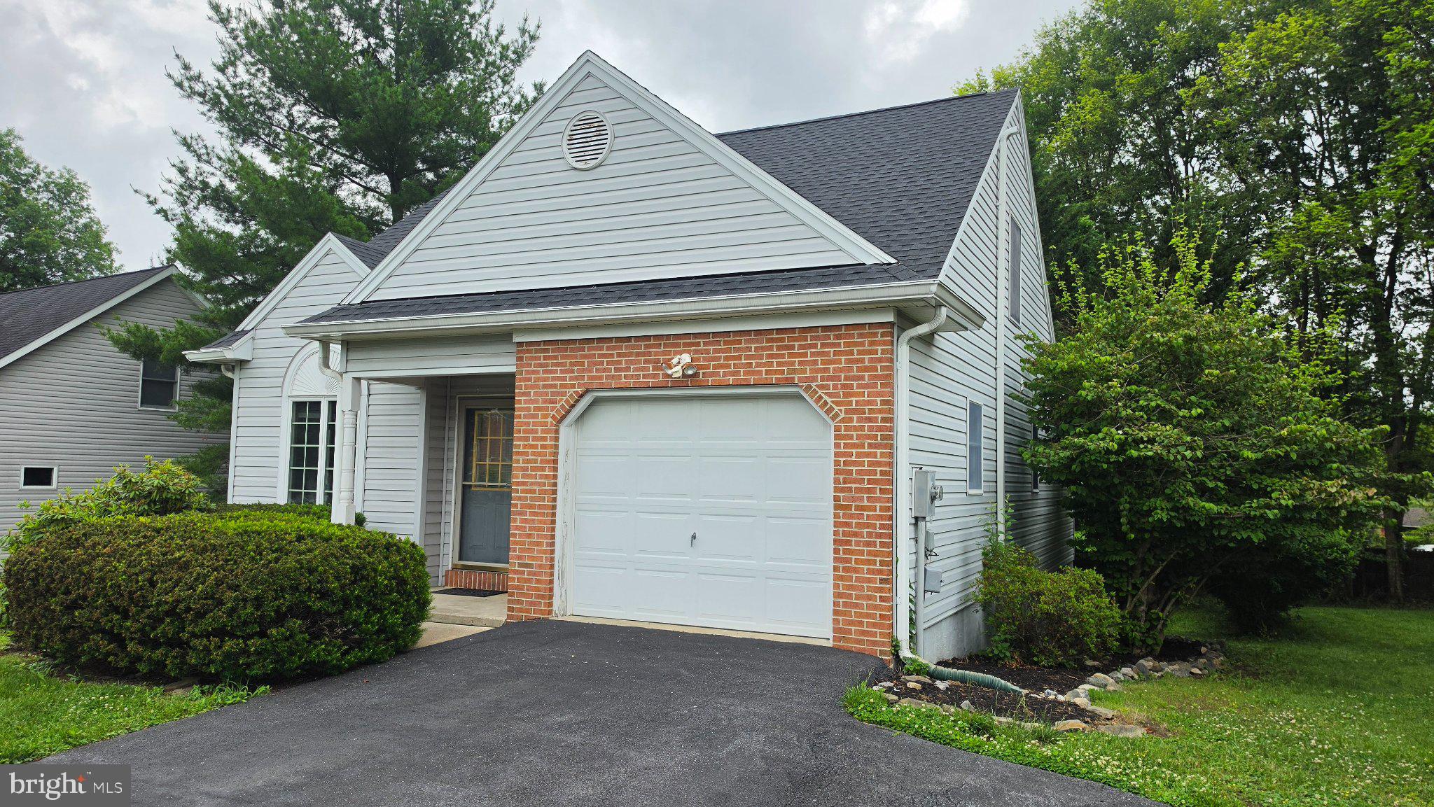 Main level living never looked so easy in this newly renovated and move-in ready contemporary home in the desirable Maddex Farm community with its connecting pathways to the town and University.  Brand new architectural shingles, freshly painted with hardwood floors, and new carpet in the bedrooms with luxury vinyl tile in the bathrooms - this home has been renovated on all levels, inside and out!  The hybrid floor plan features an updated kitchen space that connects to an open dining and family room with beautiful vaulted ceilings and a sliding glass walkout to the refinished deck and private backyard.  There's a primary bedroom and bathroom suite on the main floor and two guest berke that share a guest bedroom upstairs.  A finsihed walkout basement provides great versatility with an additional full bathroom and flexible living space.
